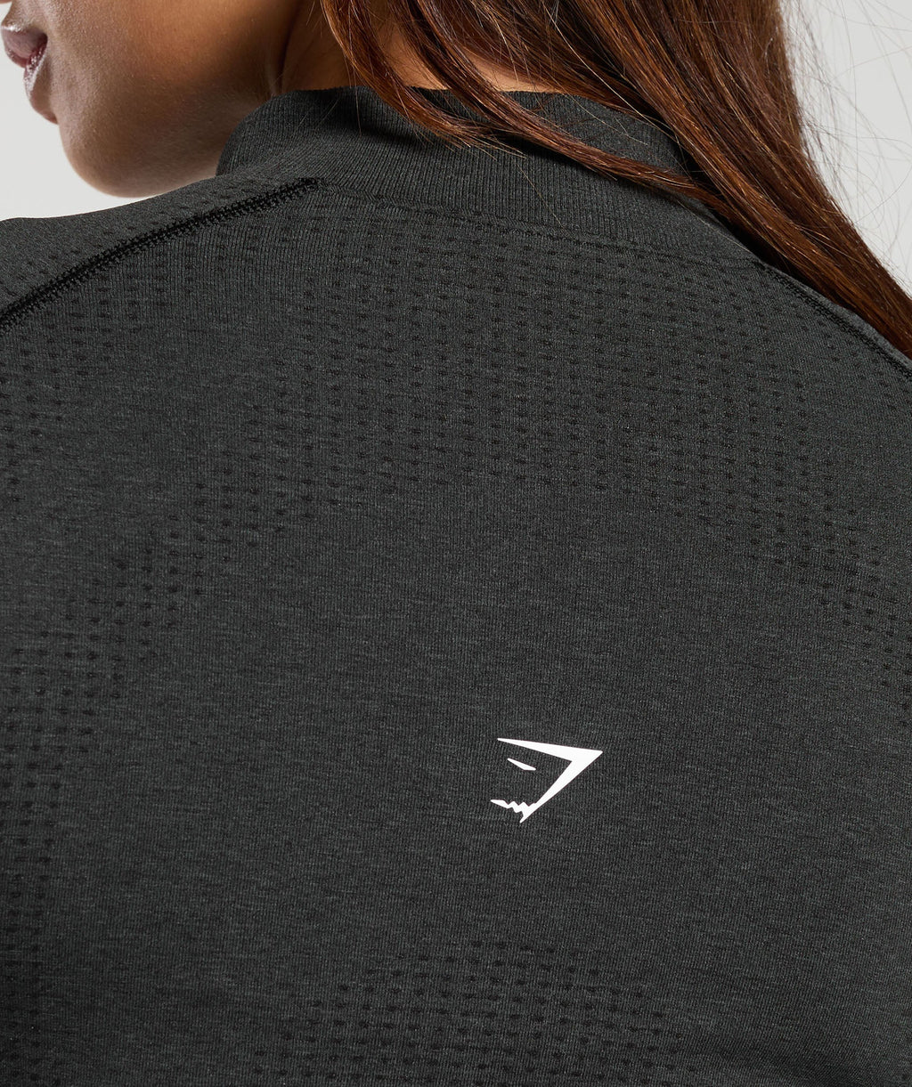 gymshark-vital-seamless-1-2-zip-pullover-black-marl-white-logo