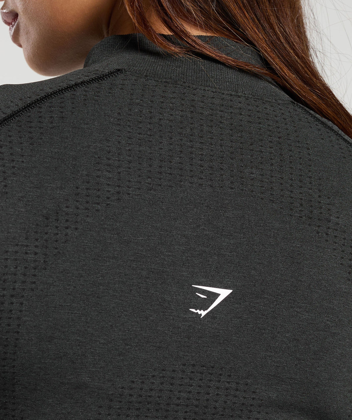 gymshark-vital-seamless-1-2-zip-pullover-black-marl-white-logo
