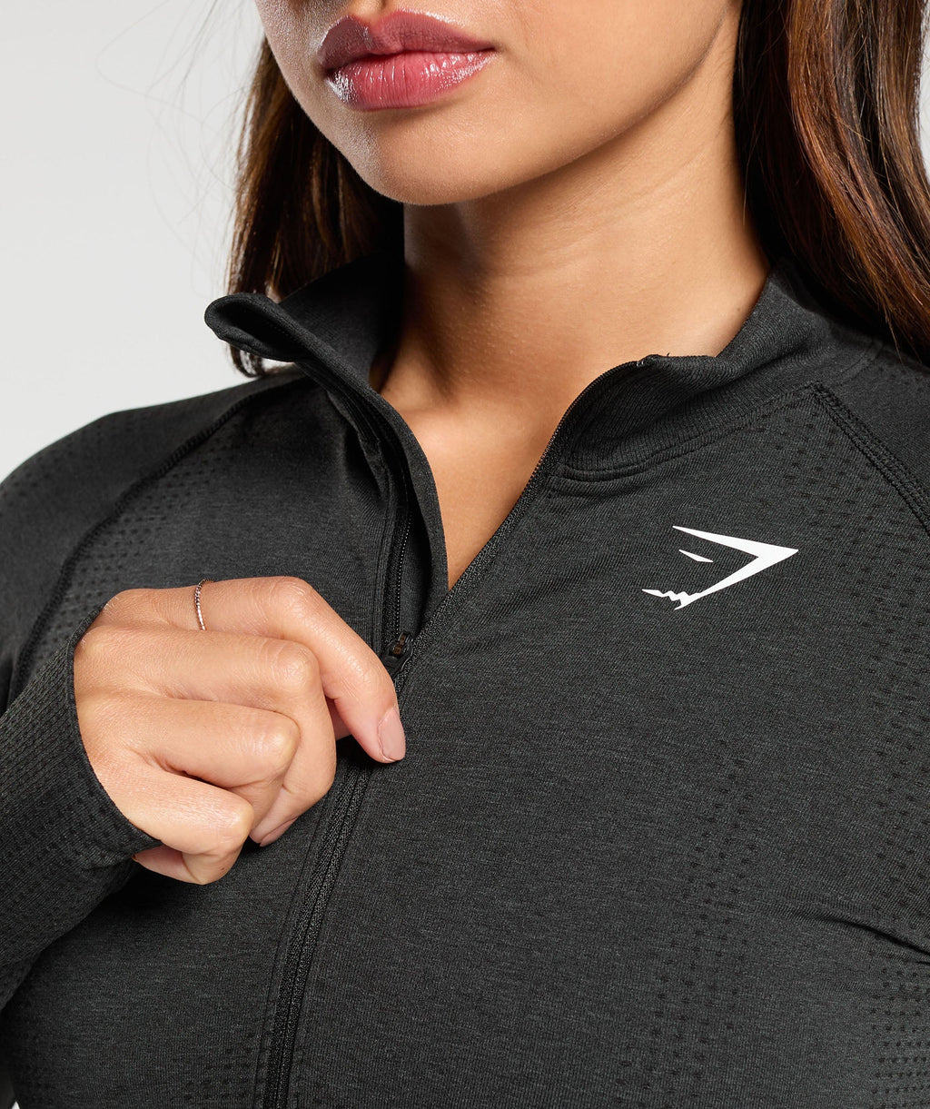 gymshark-vital-seamless-1-2-zip-pullover-black-marl-white-logo