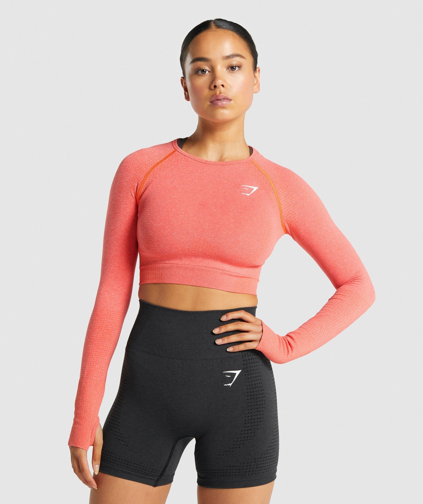 gymshark-vital-seamless-long-sleeve-crop-top-orange-marl-logo