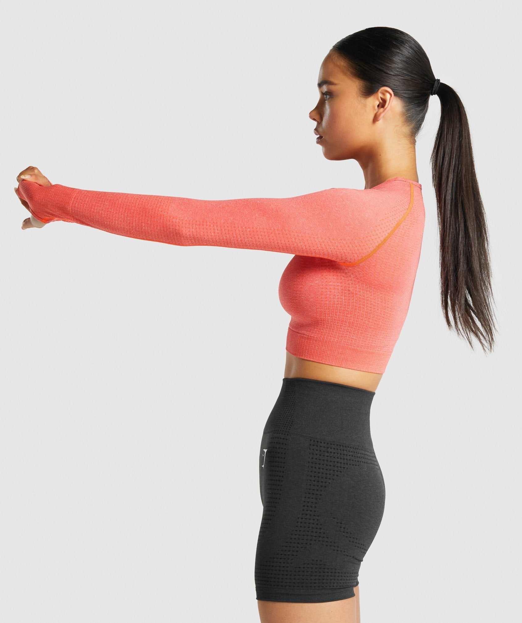 gymshark-vital-seamless-long-sleeve-crop-top-orange-marl-logo
