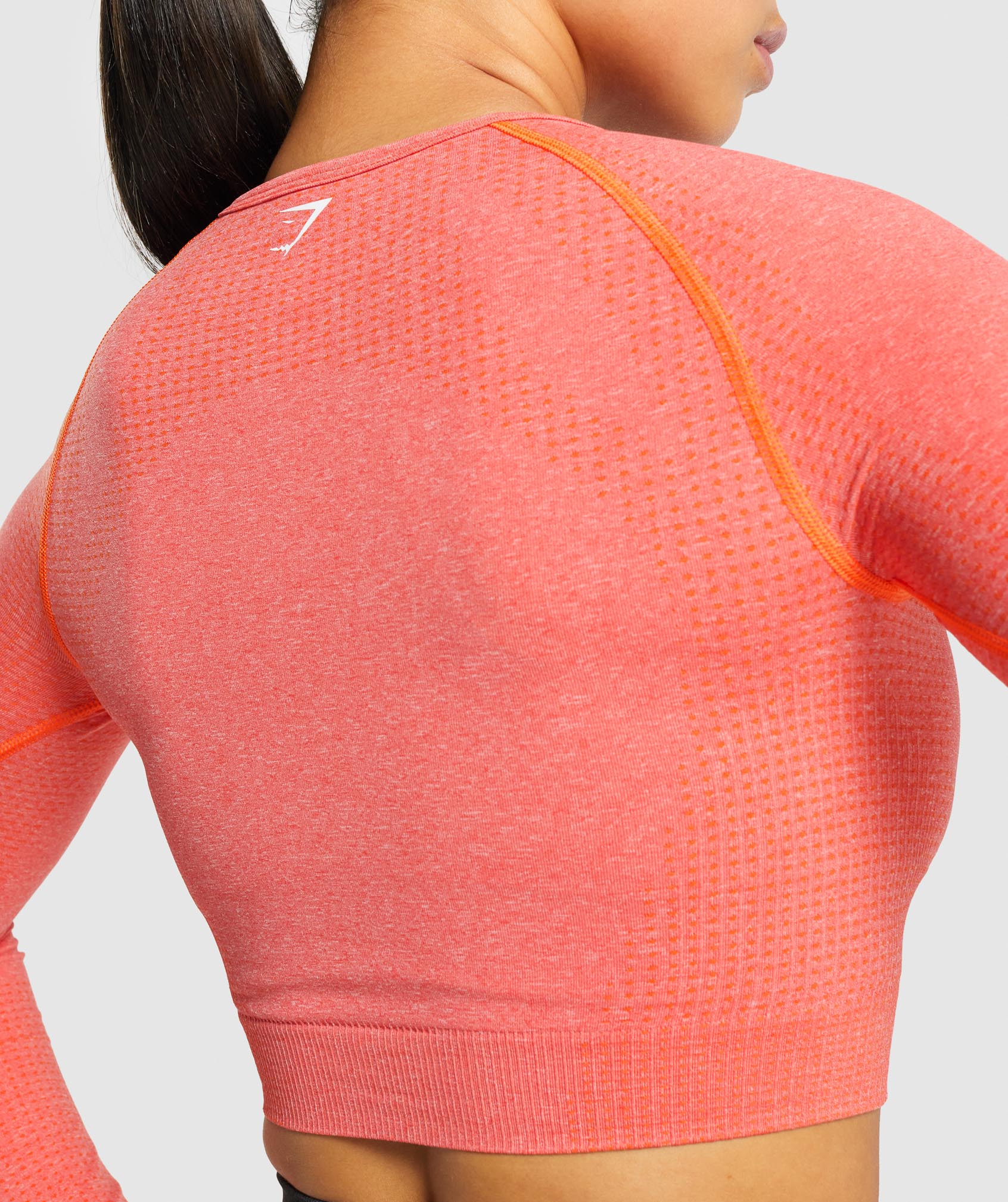 gymshark-vital-seamless-long-sleeve-crop-top-orange-marl-logo