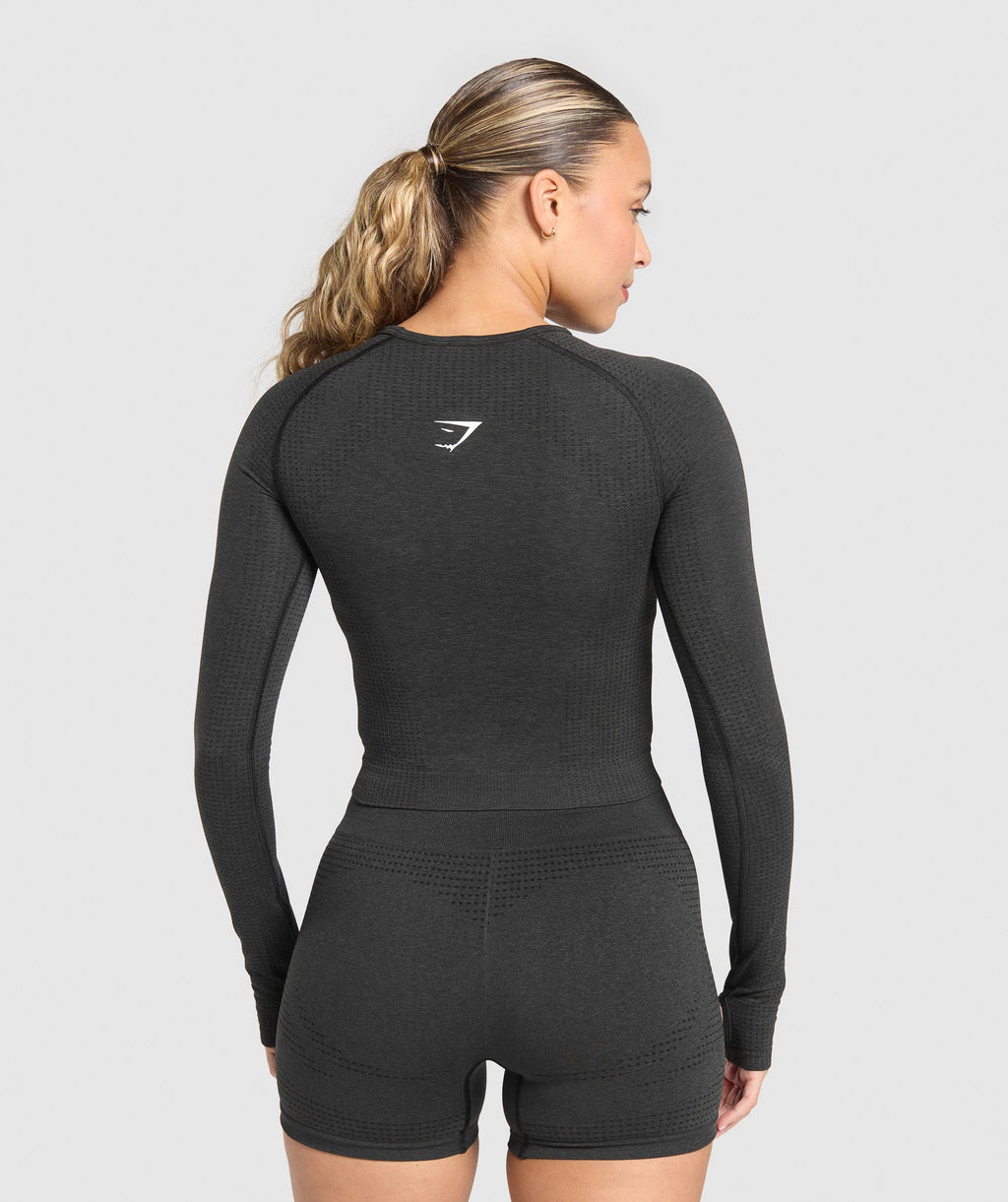 gymshark-vital-seamless-long-sleeve-cut-out-top-black-marl-ss25