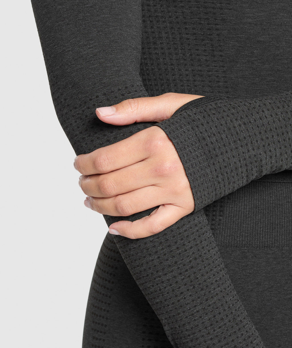 gymshark-vital-seamless-long-sleeve-cut-out-top-black-marl-ss25
