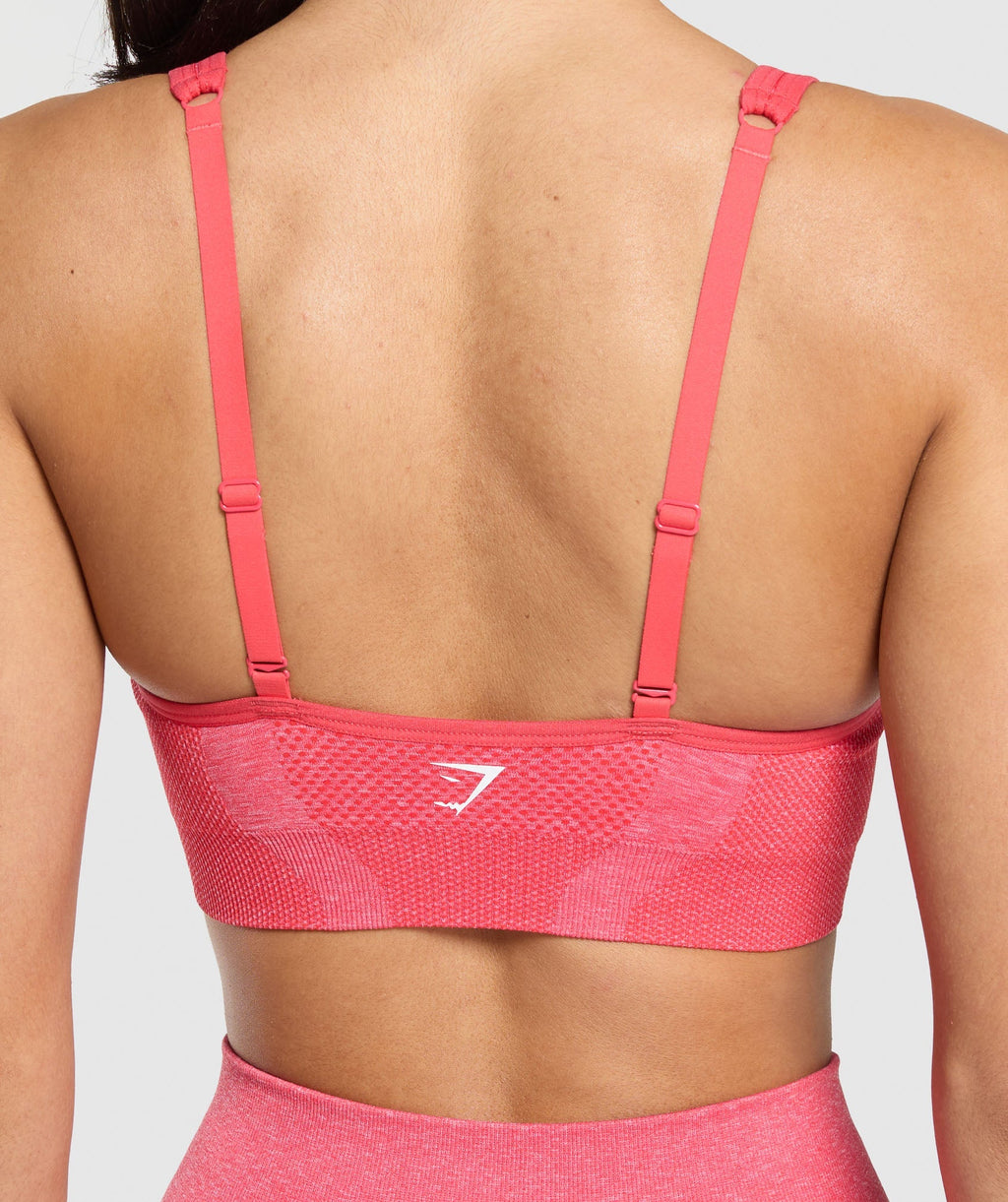 gymshark-vital-seamless-v-neck-sports-bra-coral-red-marl-ss25