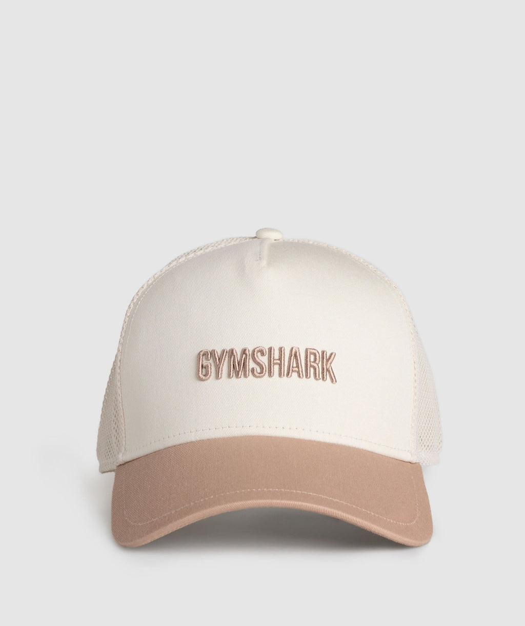 gymshark-wordmark-trucker-cap-oat-white-deep-fawn-brown-ss25