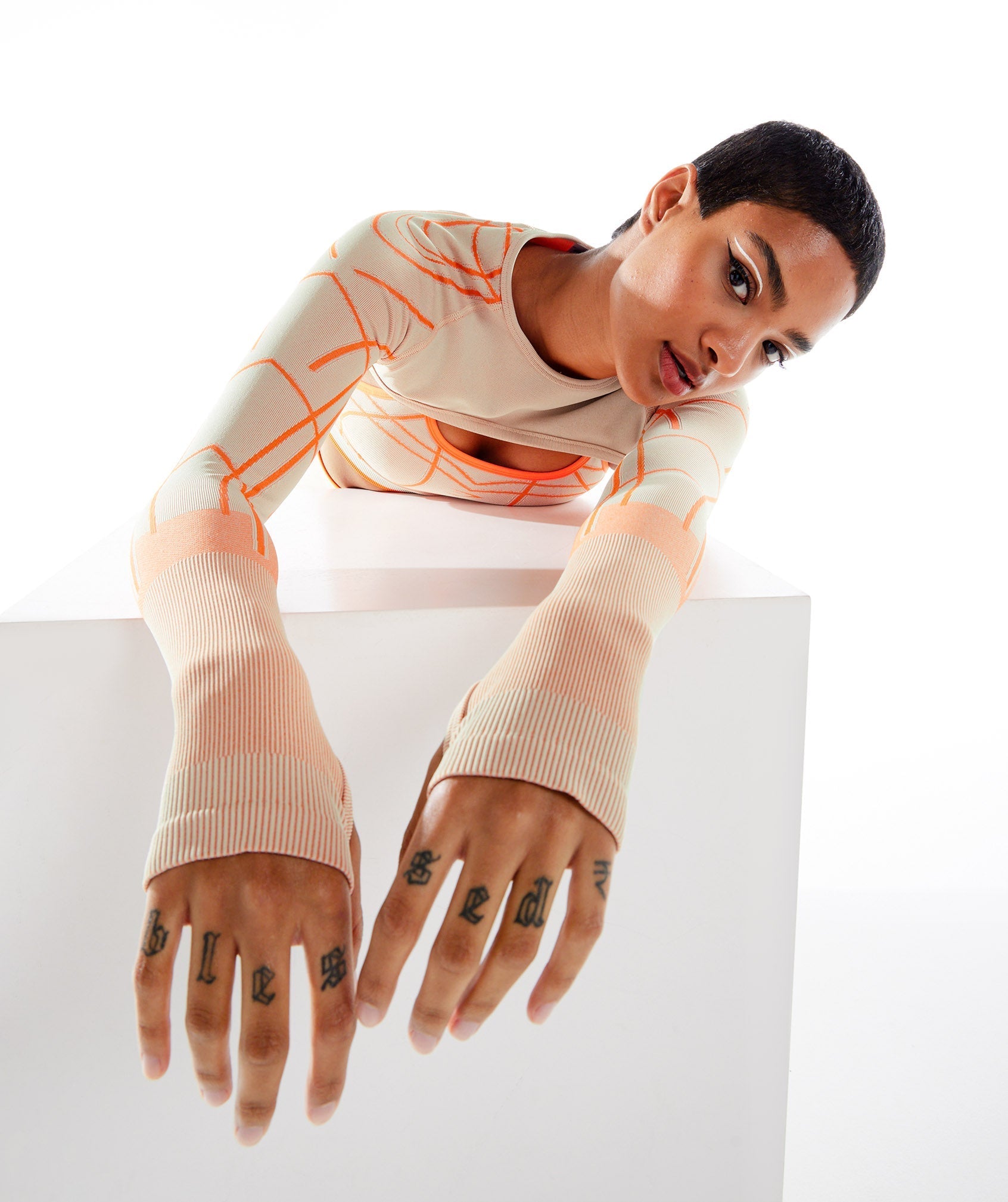 gymshark-wtflex-linear-seamless-long-sleeve-shrug-pebble-grey-orange-coconut-white-ss22