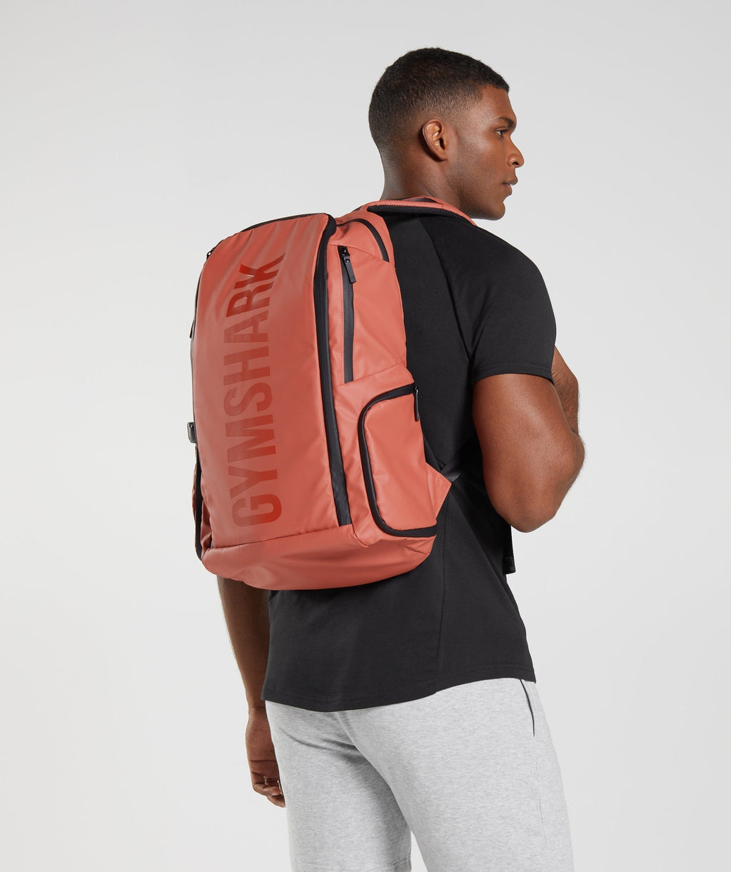 gymshark-xseries-0-3-backpack-persimmon-red-ss23