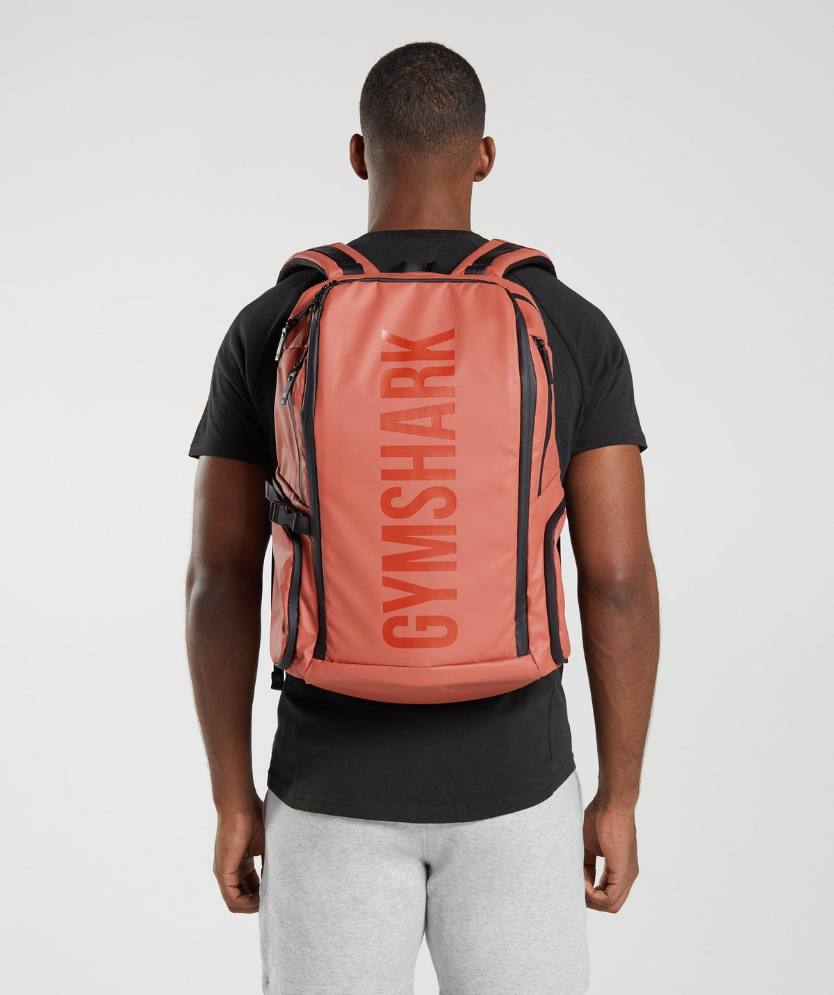 gymshark-xseries-0-3-backpack-persimmon-red-ss23