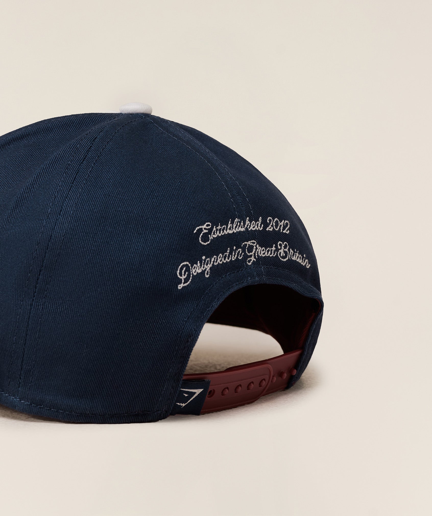 gymshark-6-panel-collegiate-trucker-headwear-blue-aw25