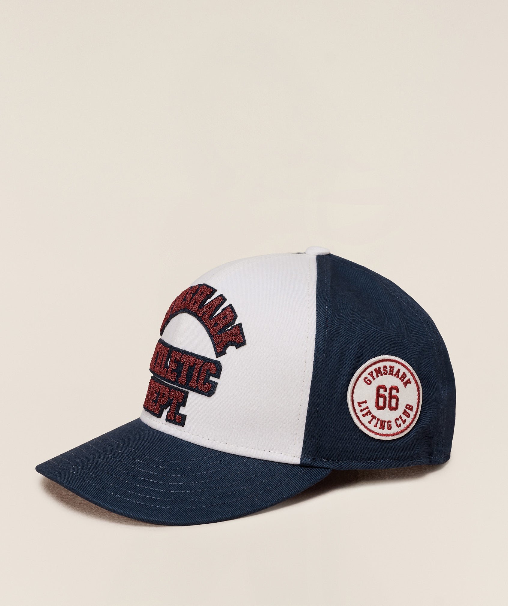 gymshark-6-panel-collegiate-trucker-headwear-blue-aw25