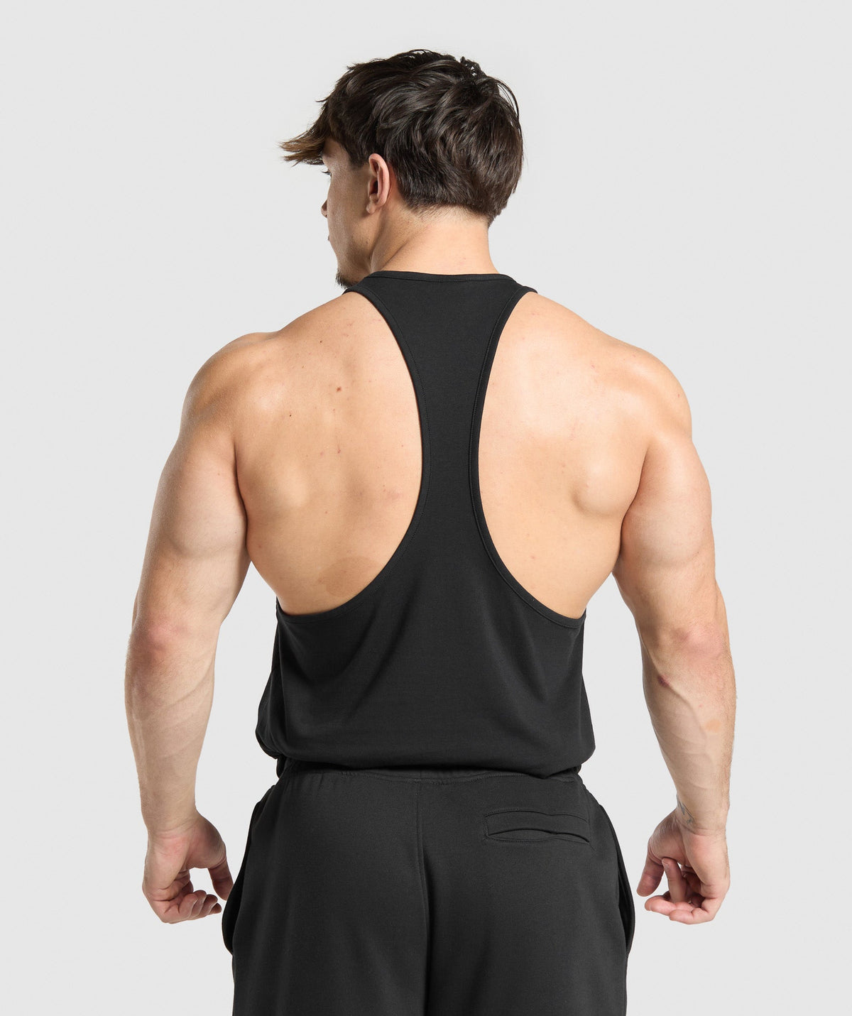 gymshark-critical-stringer-sleeveless-tops-black-ss25
