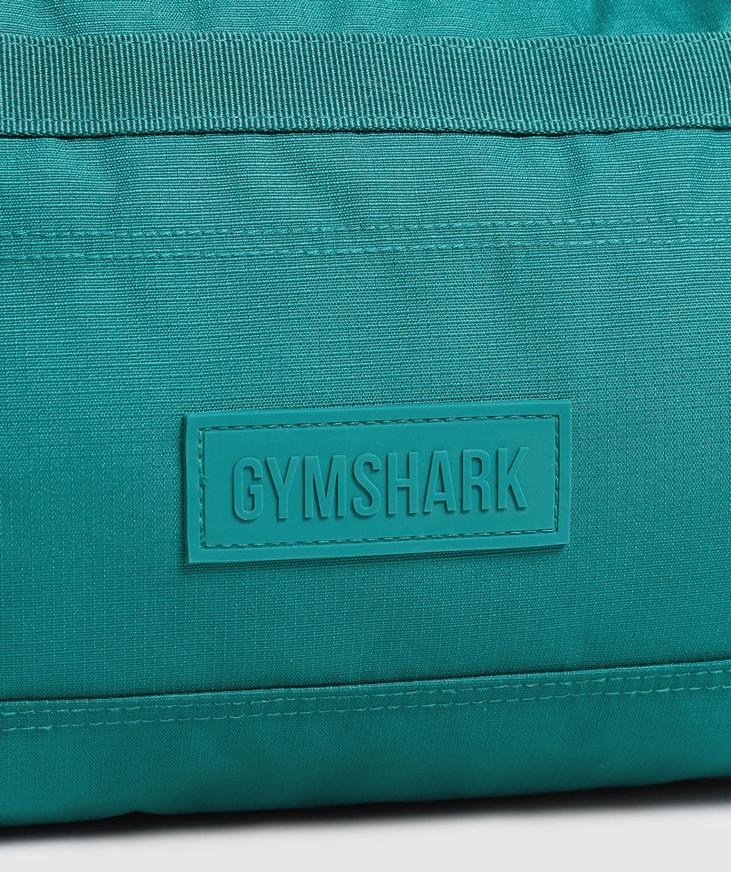 gymshark-active-holdall-small-bags-teal-ss25