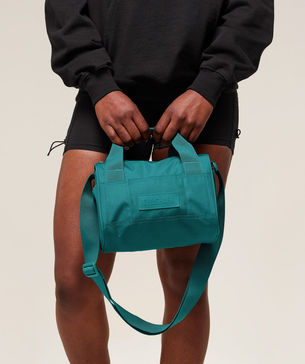 gymshark-active-holdall-mini-bags-teal-ss25
