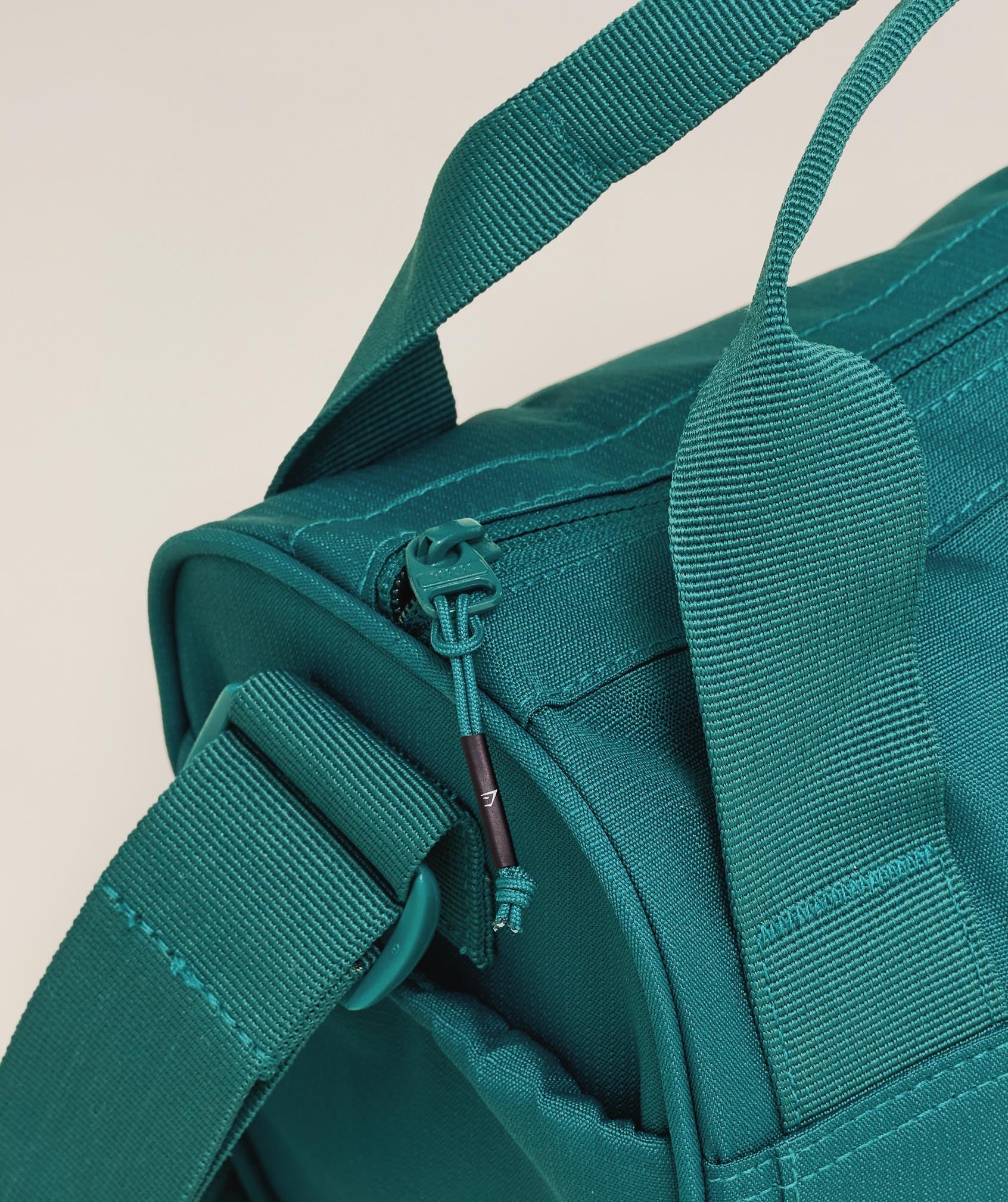 gymshark-active-holdall-mini-bags-teal-ss25