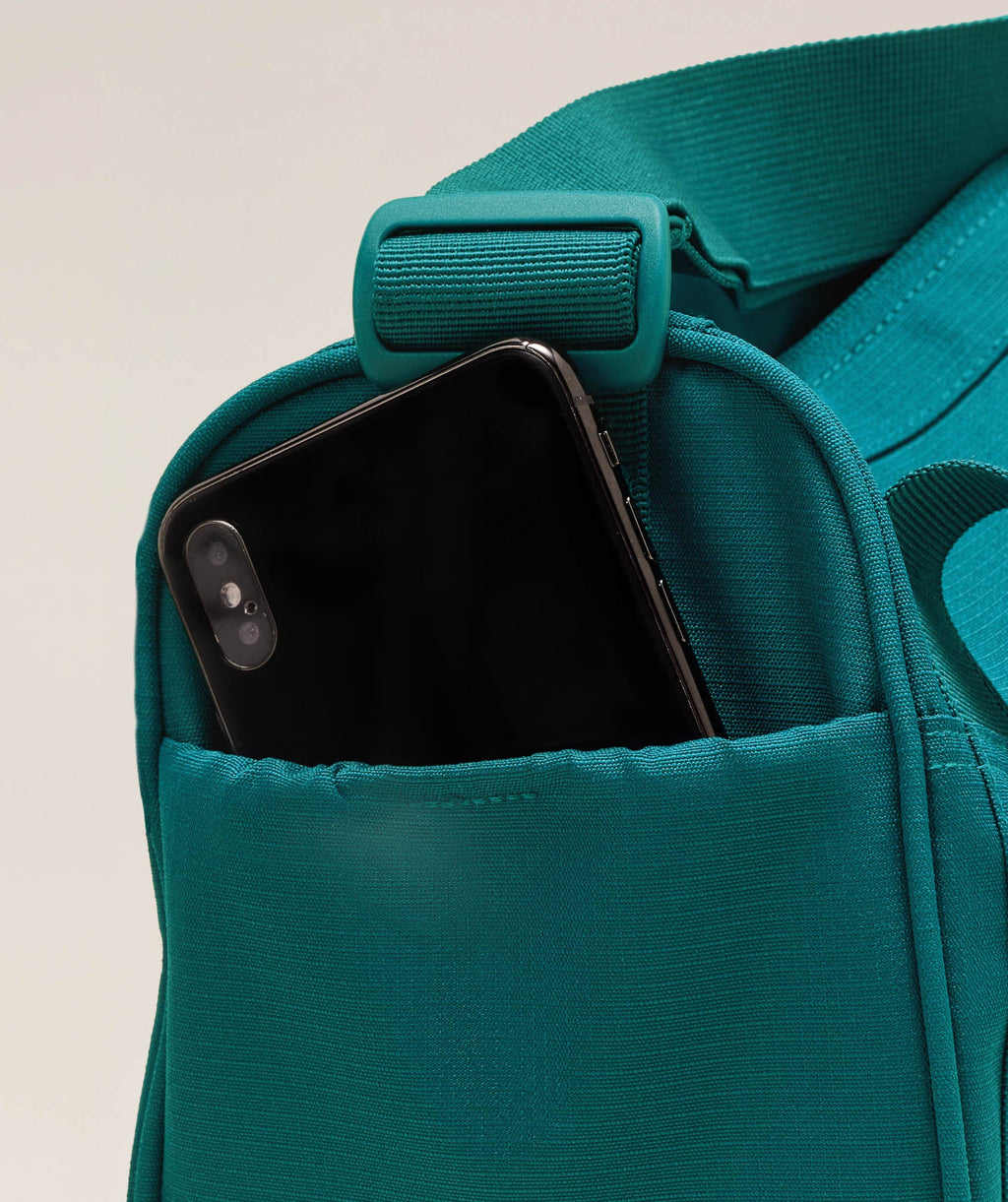 gymshark-active-holdall-mini-bags-teal-ss25