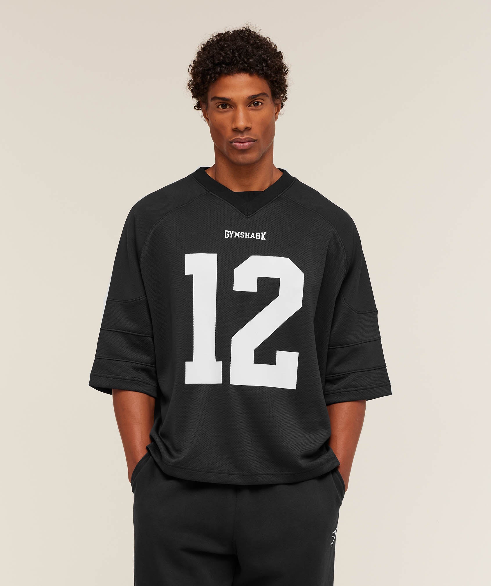 gymshark-american-football-jersey-ss-tops-black-aw25