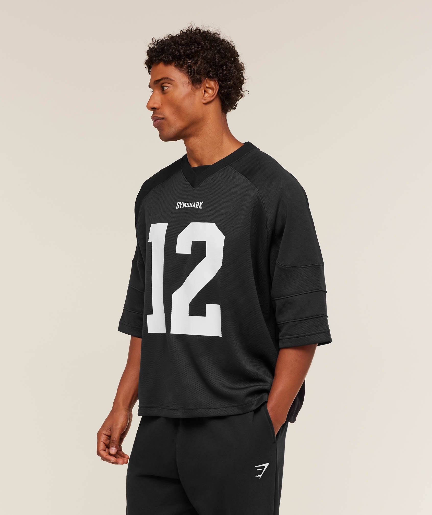 gymshark-american-football-jersey-ss-tops-black-aw25
