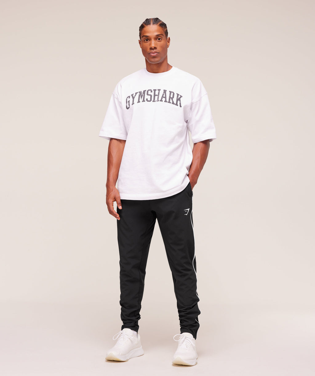 gymshark-arrival-woven-block-joggers-pants-black-aw25