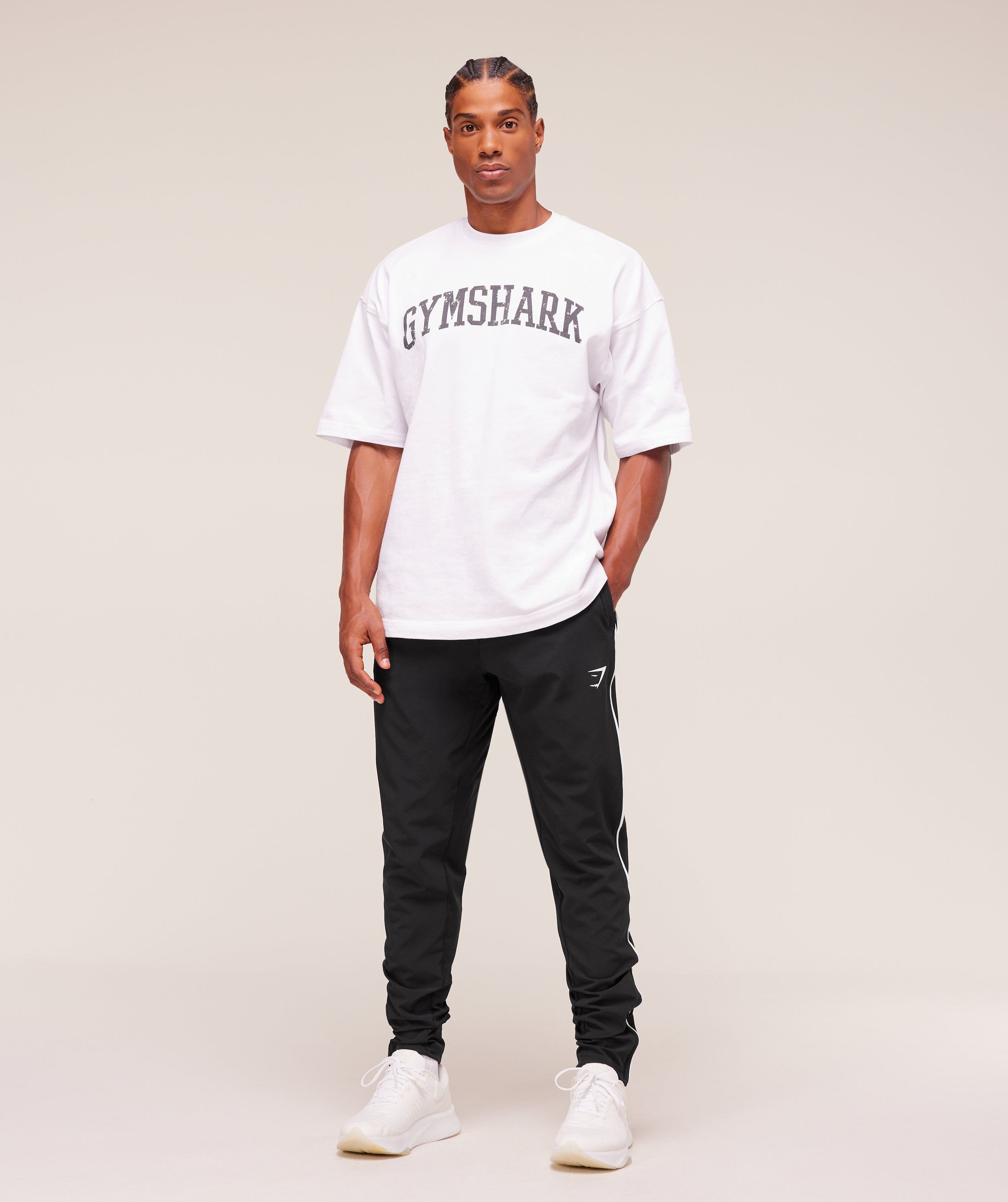 gymshark-arrival-woven-block-joggers-pants-black-aw25