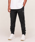 gymshark-arrival-woven-block-joggers-pants-black-aw25
