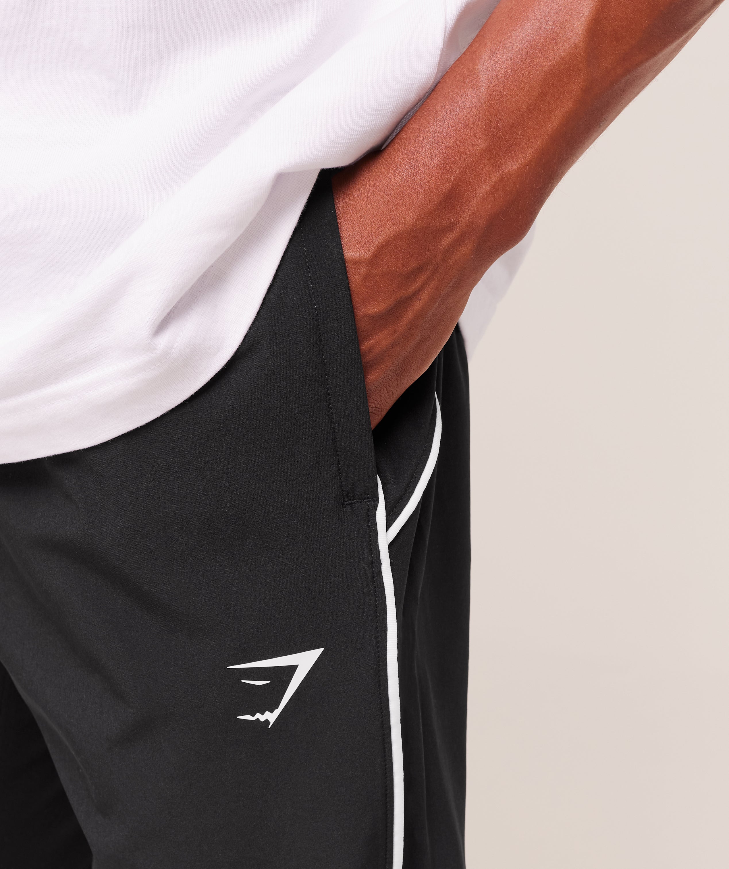 gymshark-arrival-woven-block-joggers-pants-black-aw25