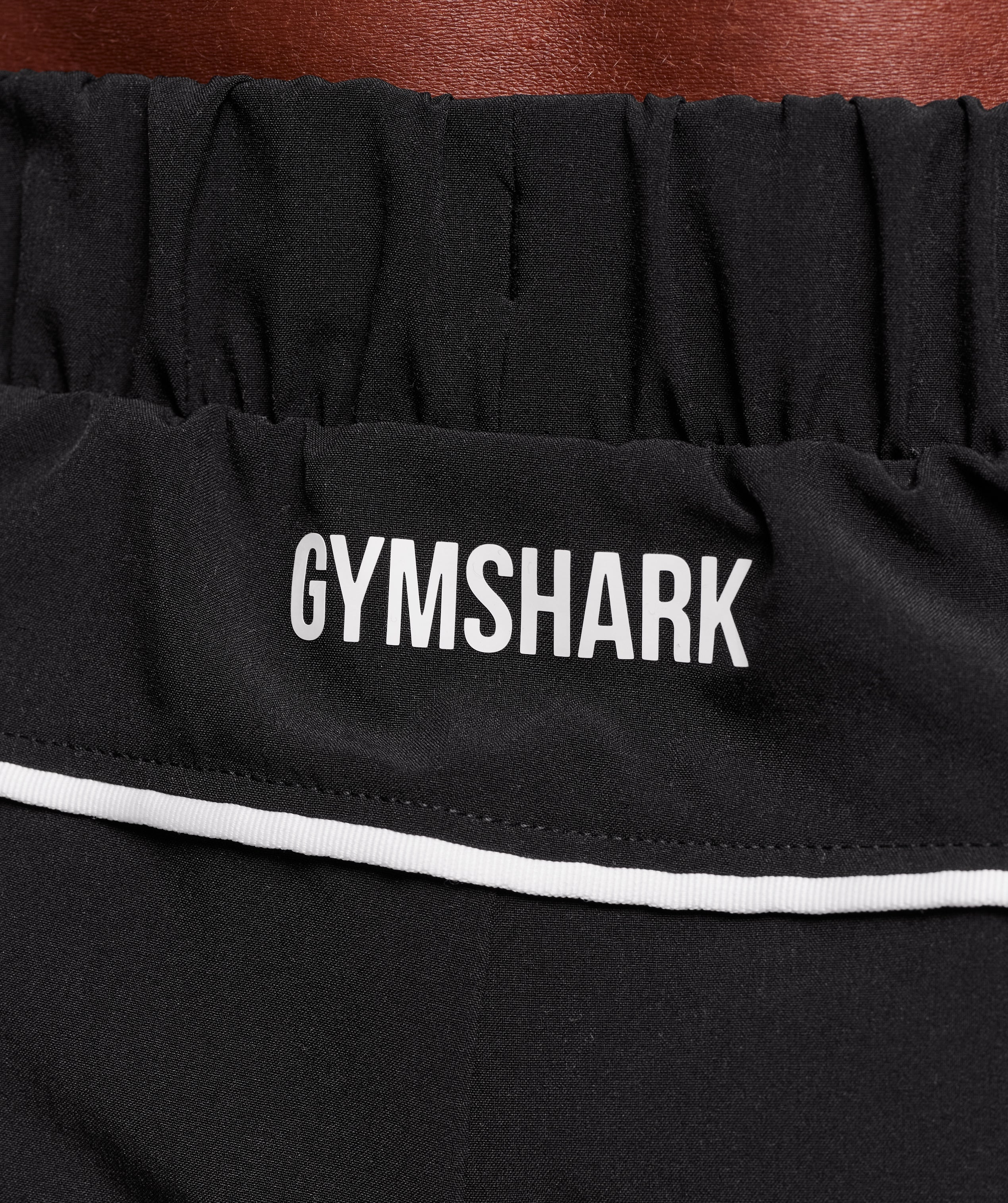 gymshark-arrival-woven-block-joggers-pants-black-aw25