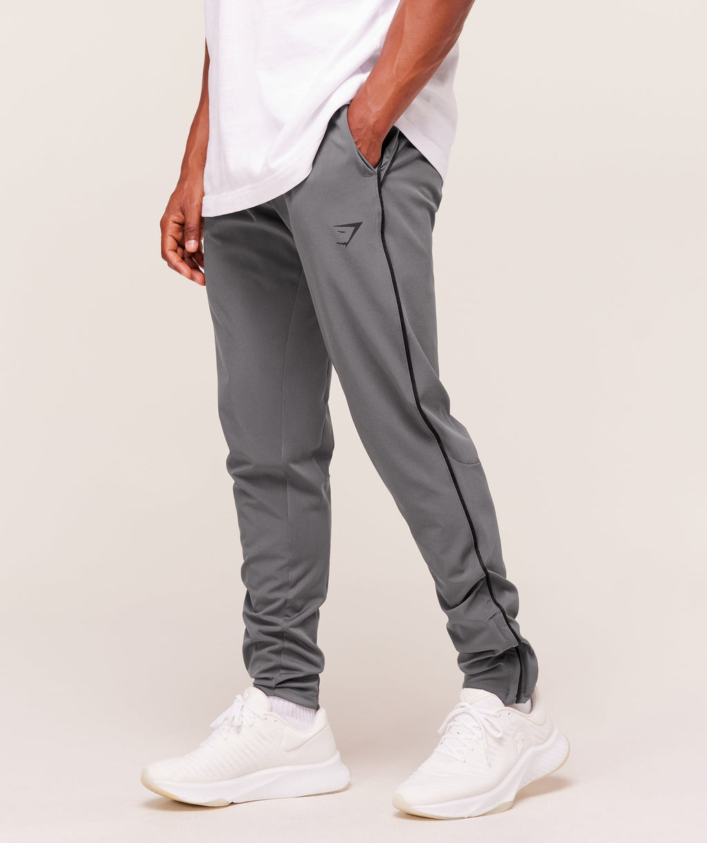 gymshark-arrival-woven-block-joggers-pants-grey-aw25