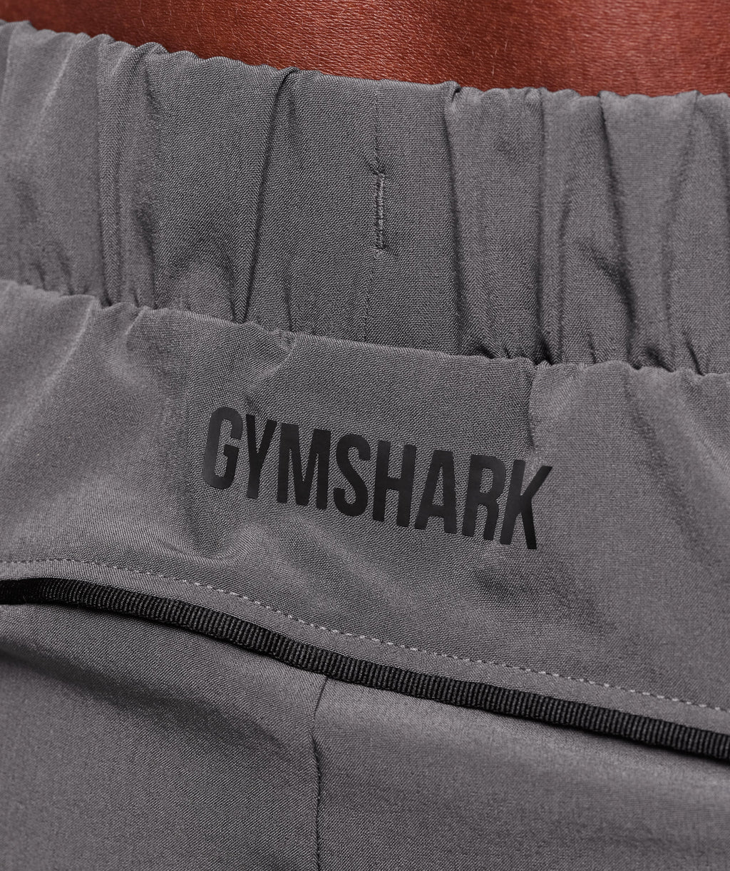 gymshark-arrival-woven-block-joggers-pants-grey-aw25