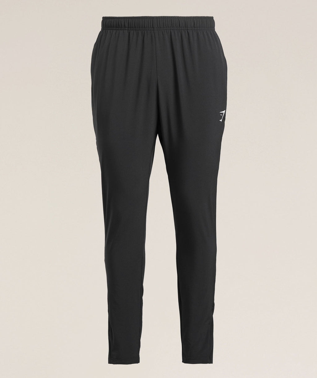 gymshark-arrival-woven-tall-joggers-black-ss25