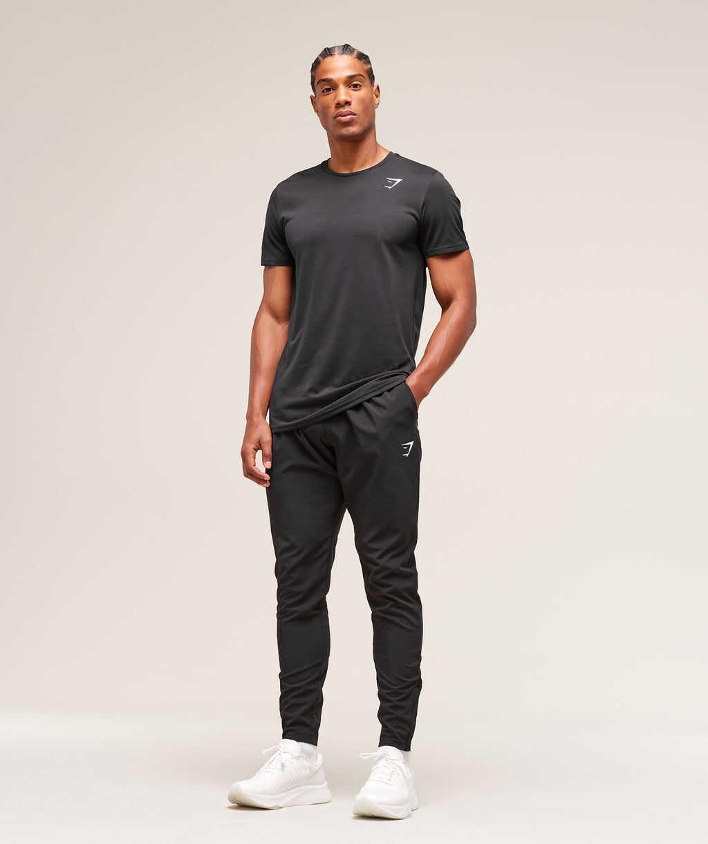 gymshark-arrival-woven-tall-joggers-black-ss25