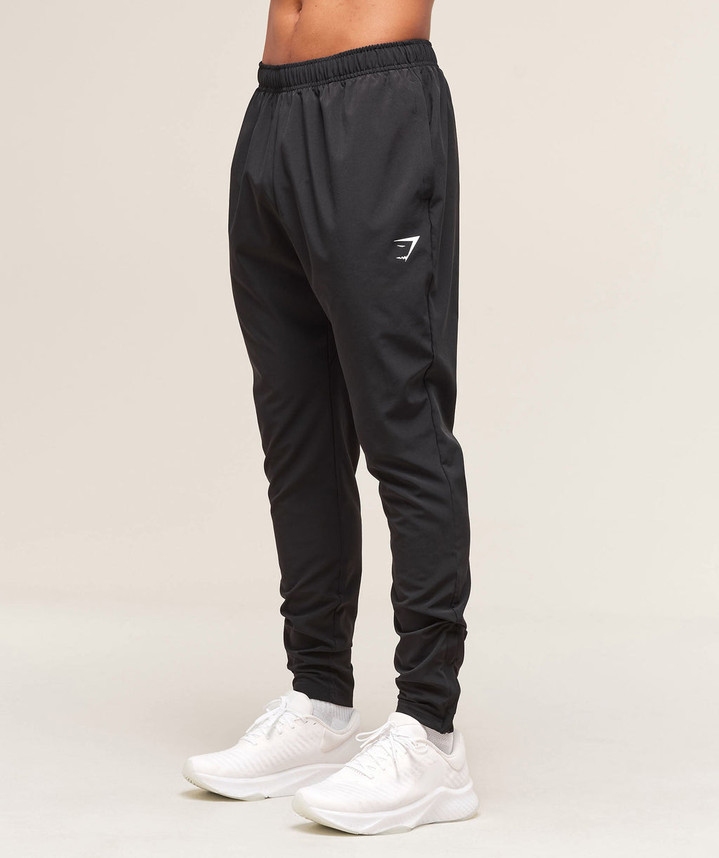 gymshark-arrival-woven-tall-joggers-black-ss25