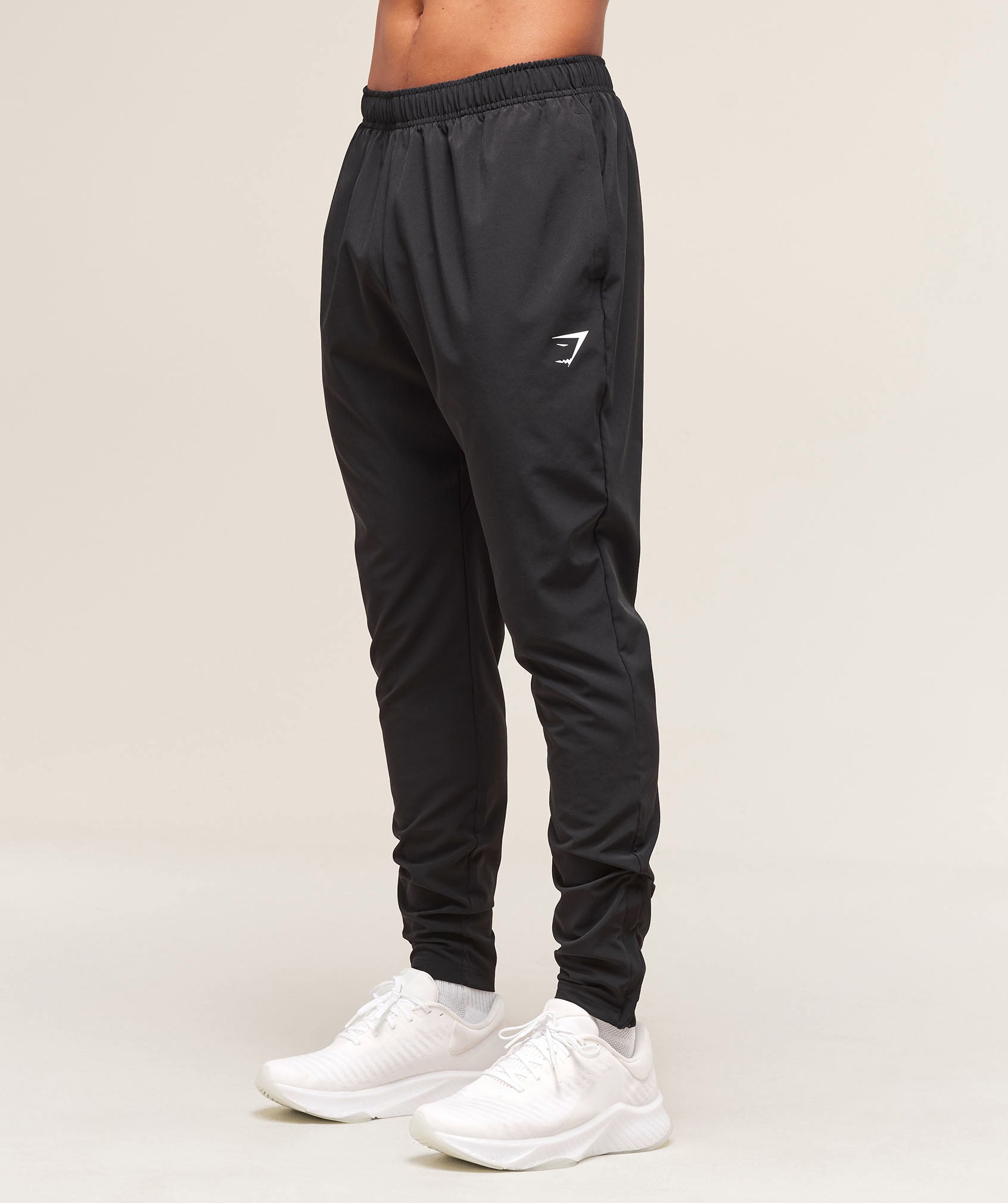 gymshark-arrival-woven-tall-joggers-black-ss25