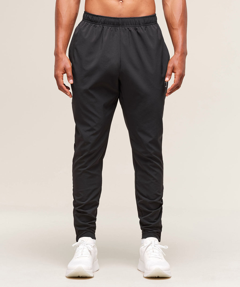 gymshark-arrival-woven-tall-joggers-black-ss25