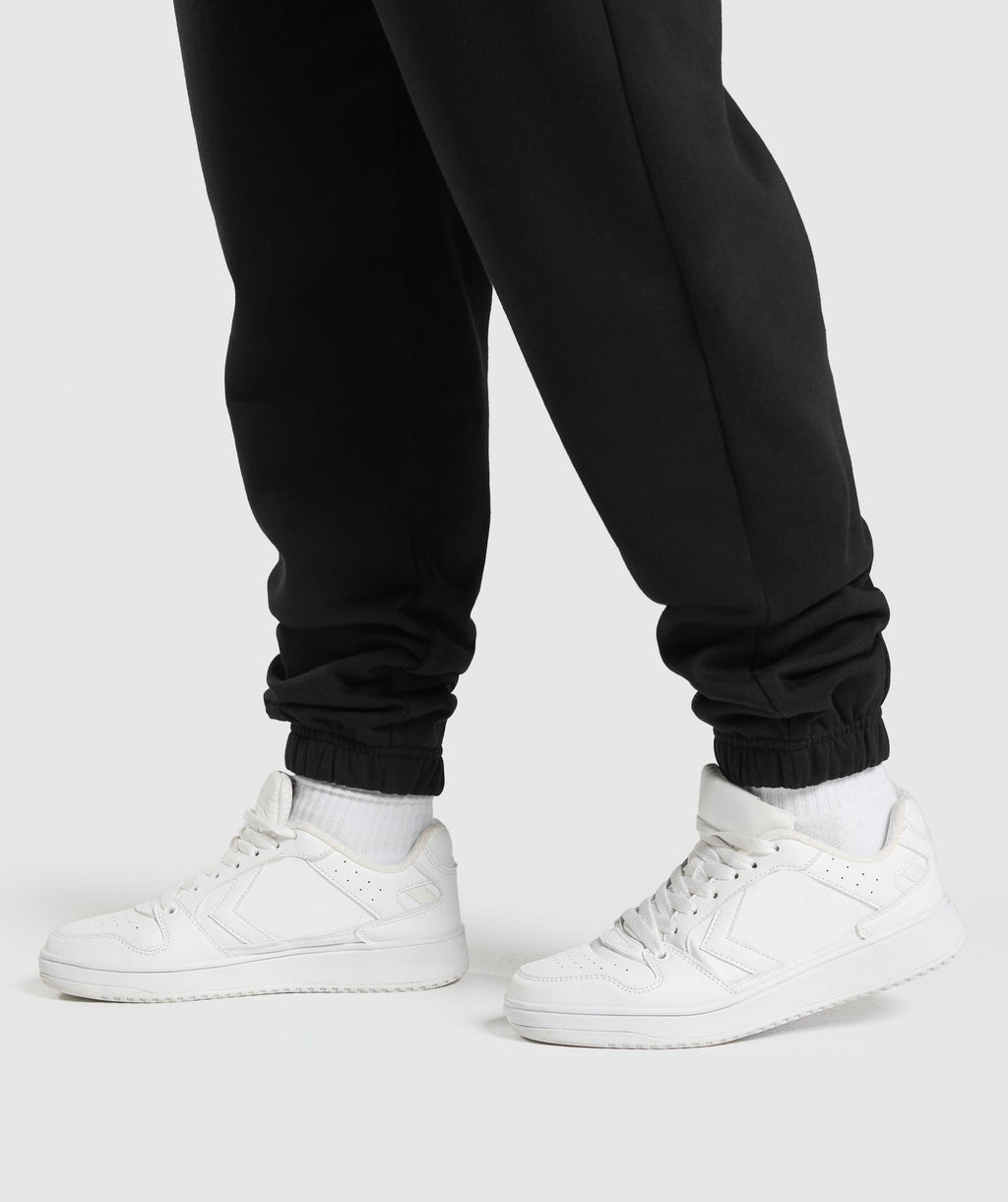 gymshark-lifting-essentials-graphic-brushed-oversized-joggers-black-ss25