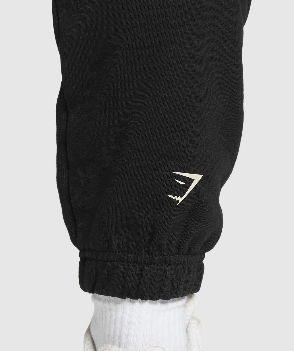 gymshark-lifting-essentials-graphic-brushed-oversized-joggers-black-ss25
