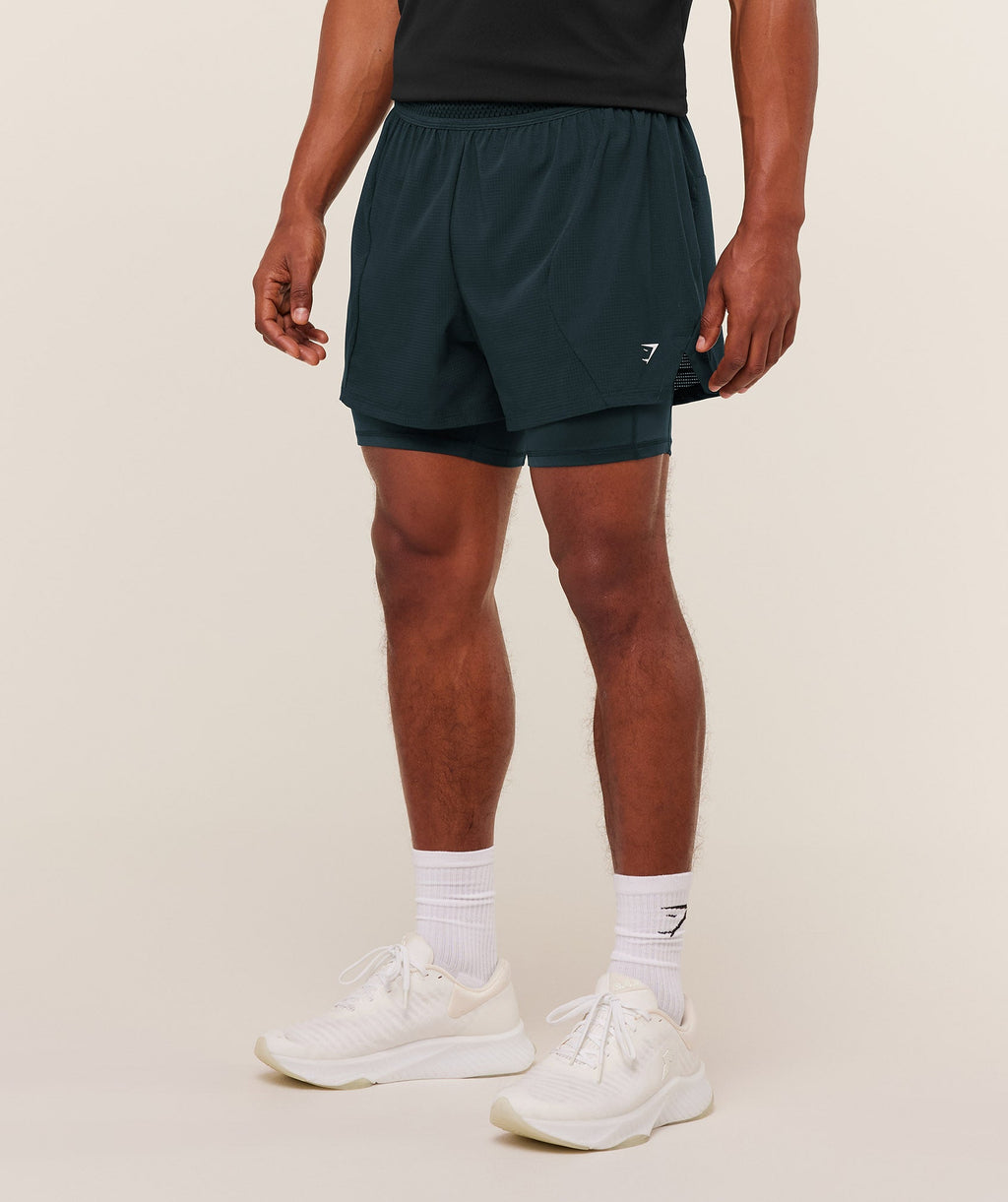 gymshark-running-4-2in1-shorts-shorts-blue-aw25-1