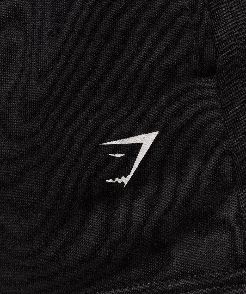 gymshark-collegiate-graphic-fleece-shorts-shorts-black-ss25