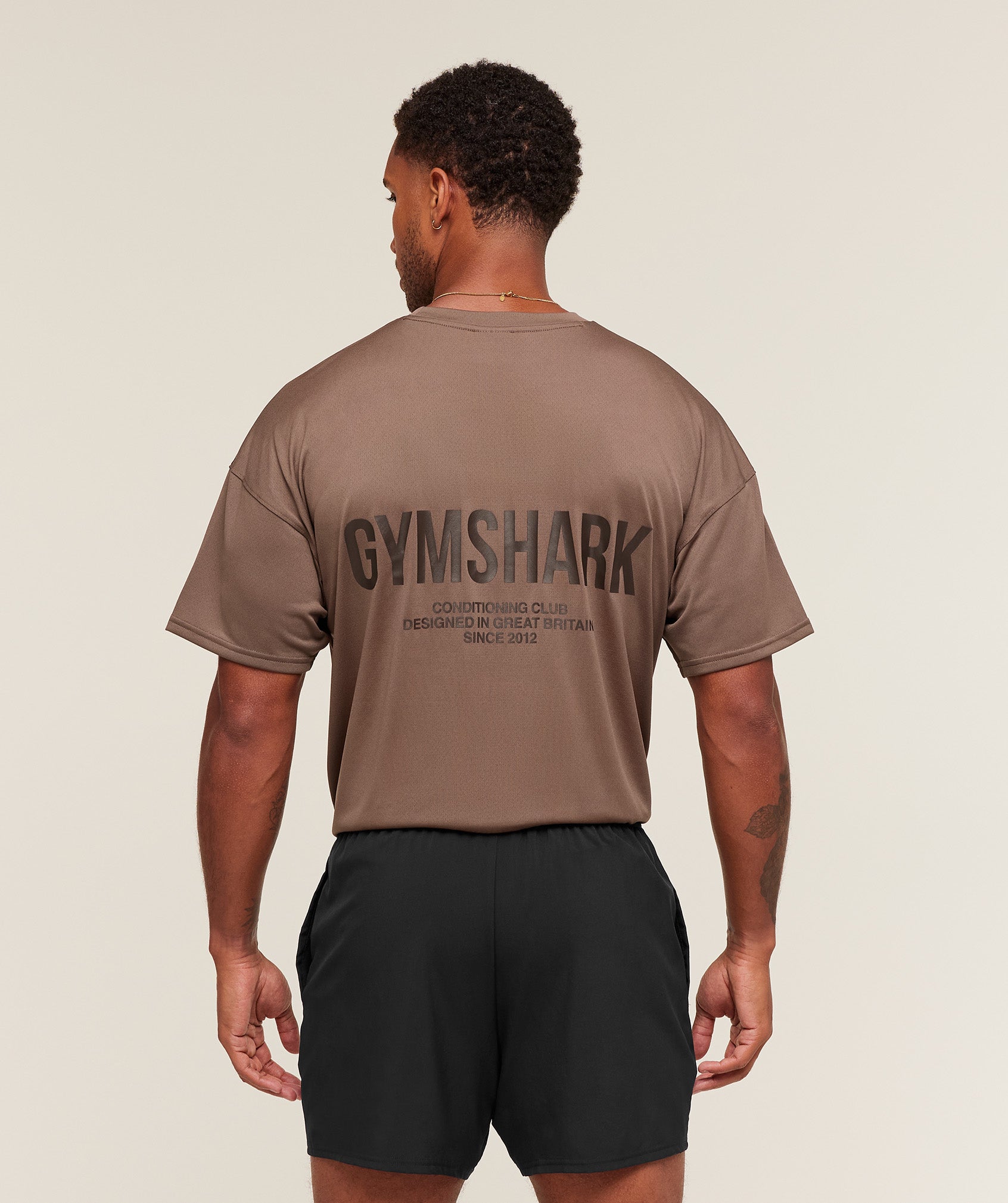 gymshark-conditioning-club-oversized-t-shirt-ss-tops-brown-aw25-1
