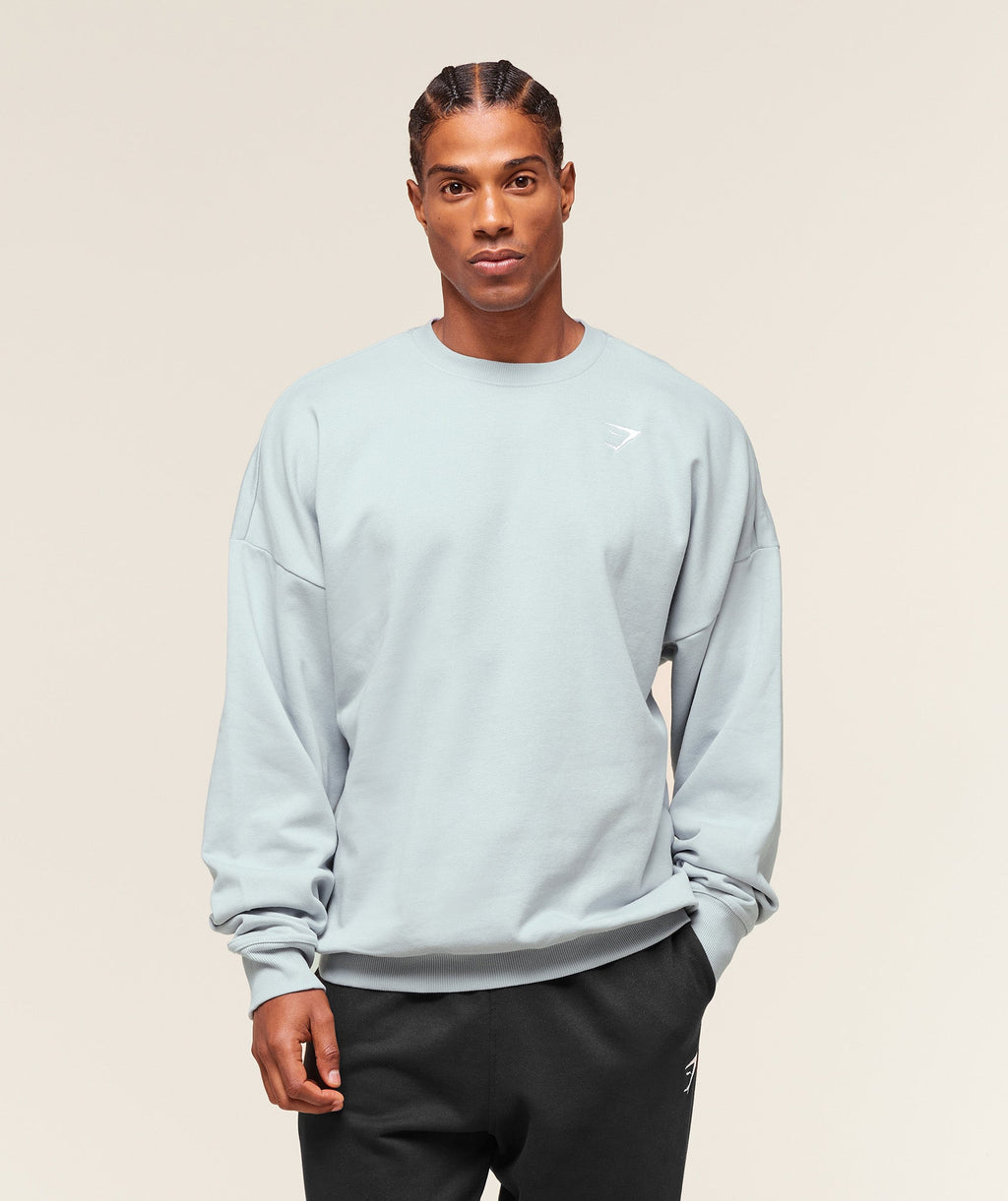 gymshark-crest-oversized-crew-pullovers-blue-aw25
