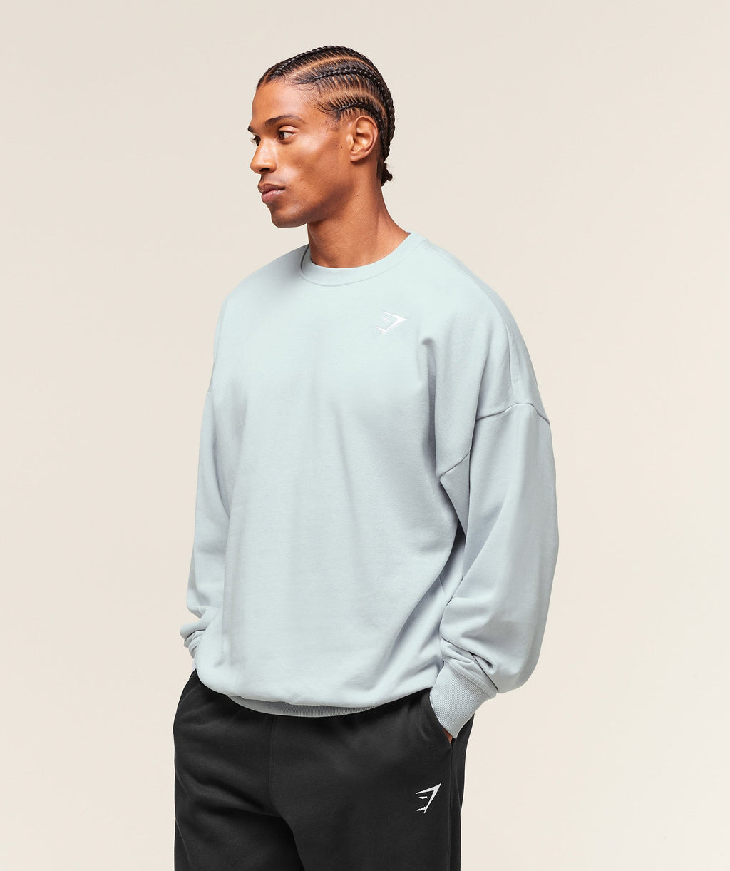 gymshark-crest-oversized-crew-pullovers-blue-aw25