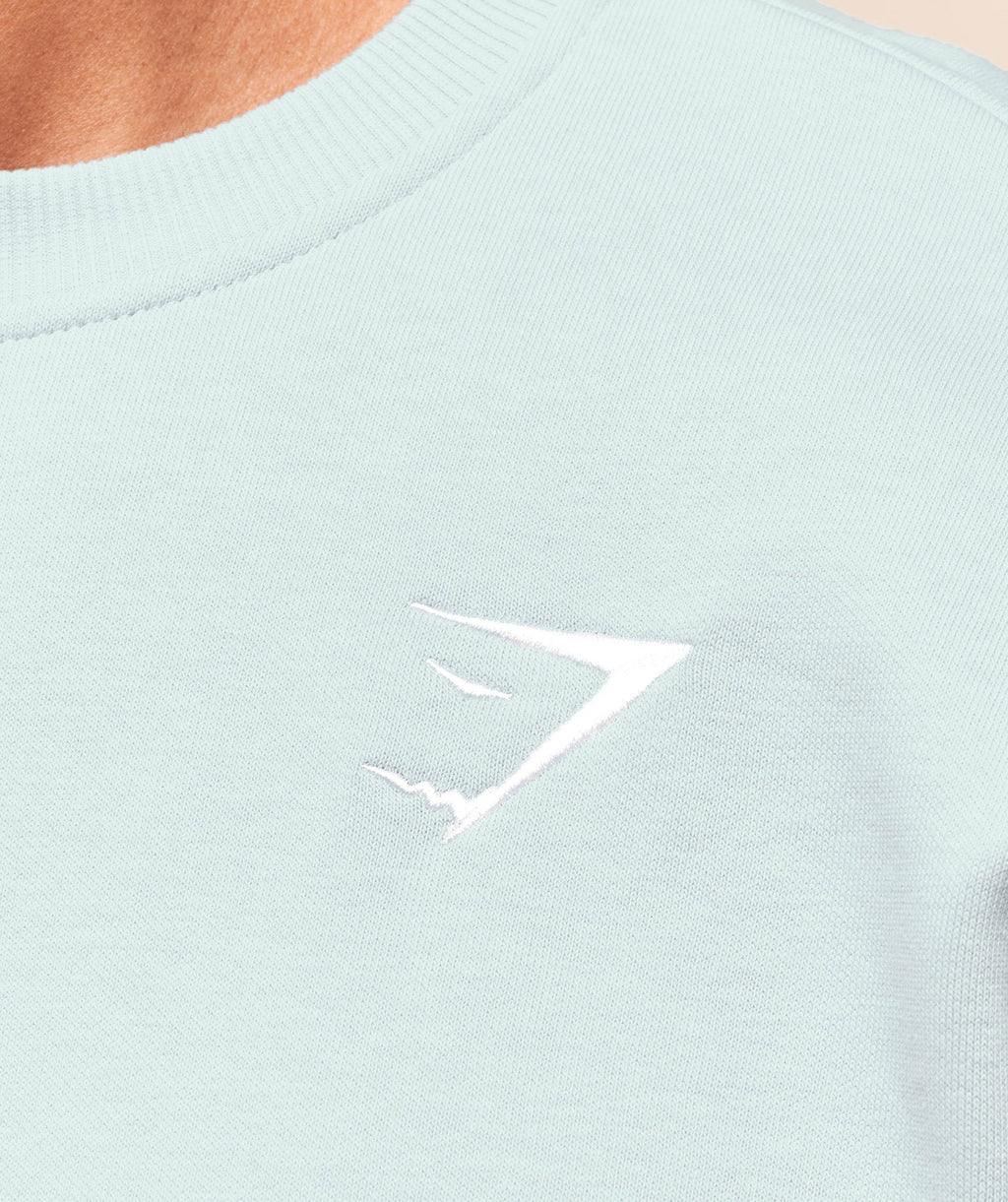 gymshark-crest-oversized-crew-pullovers-blue-aw25