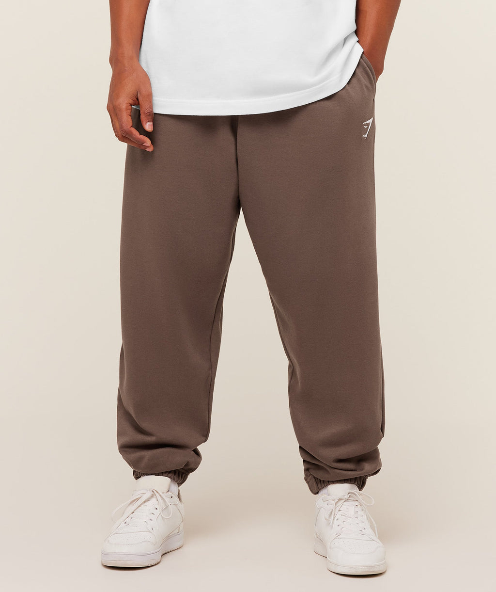 gymshark-crest-oversized-jogger-pants-brown-ss26