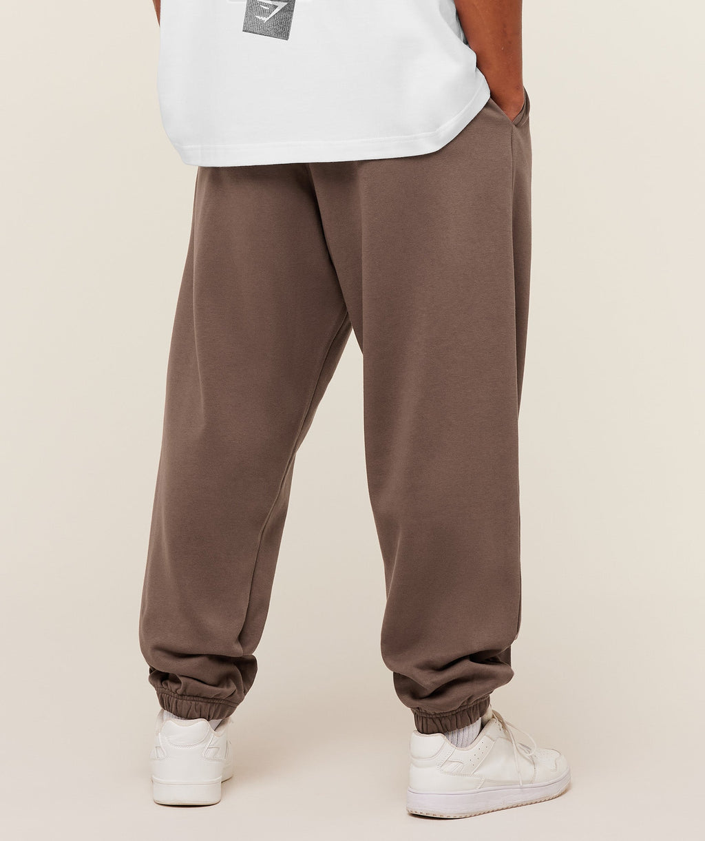 gymshark-crest-oversized-jogger-pants-brown-ss26