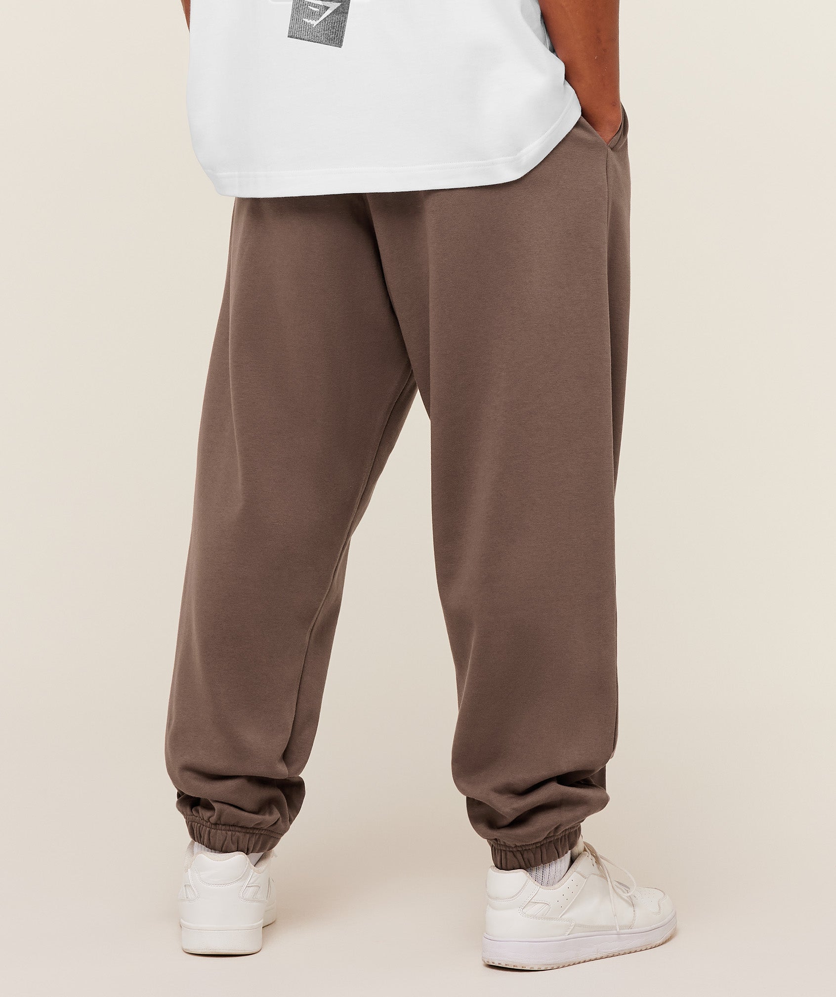 gymshark-crest-oversized-jogger-pants-brown-ss26