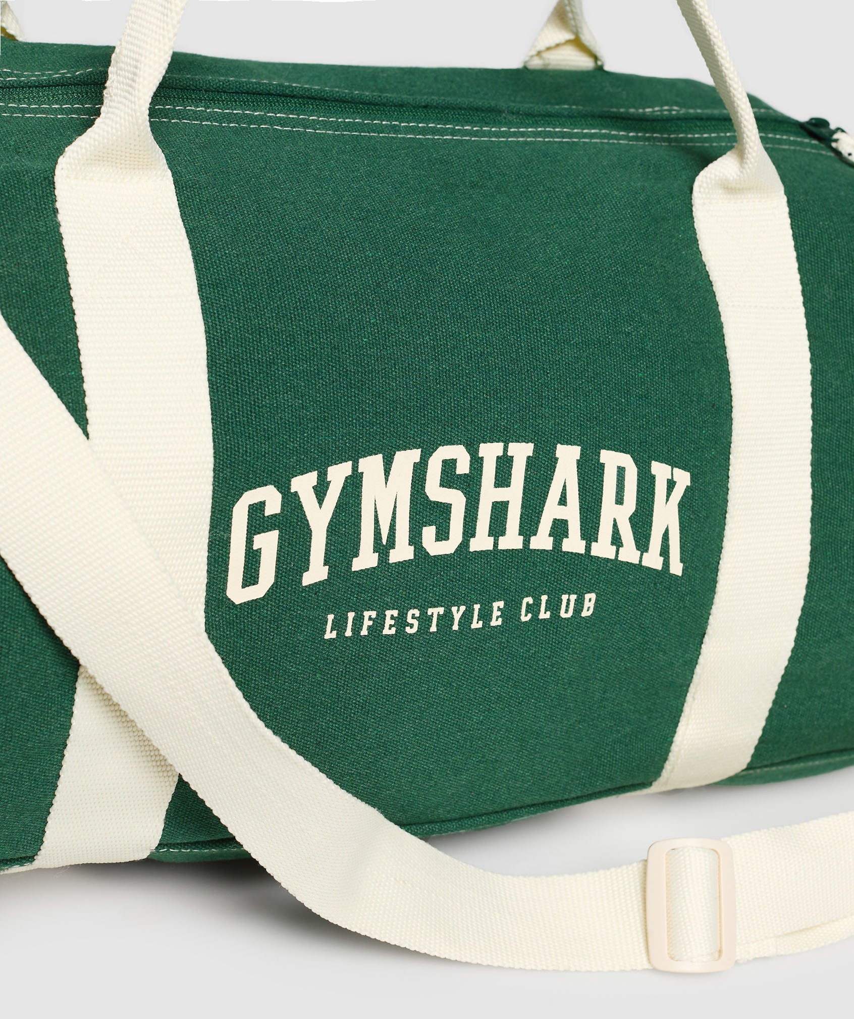 gymshark-collegiate-canvas-duffle-bags-green-ss25