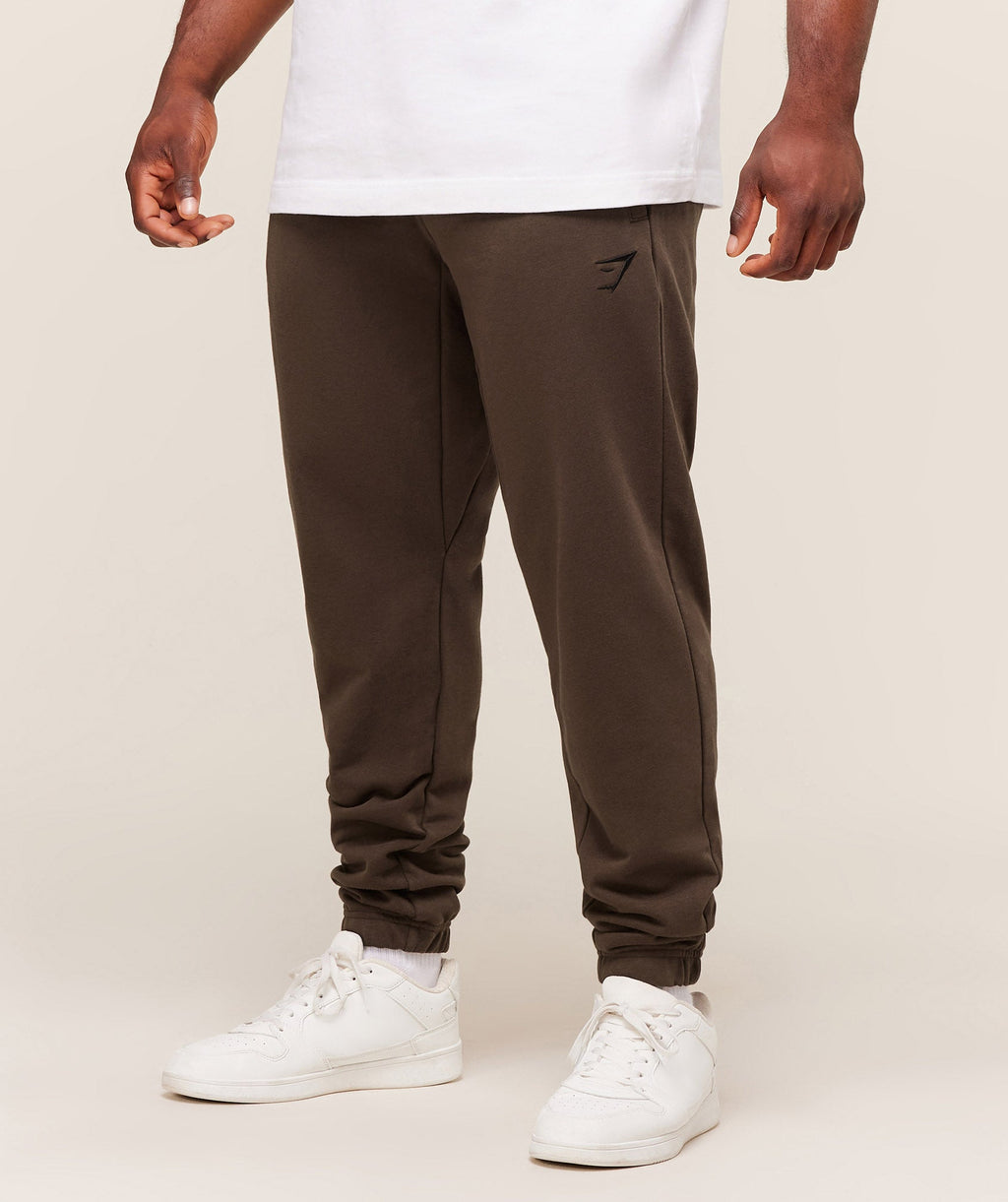 gymshark-essential-oversized-joggers-pants-brown-aw25