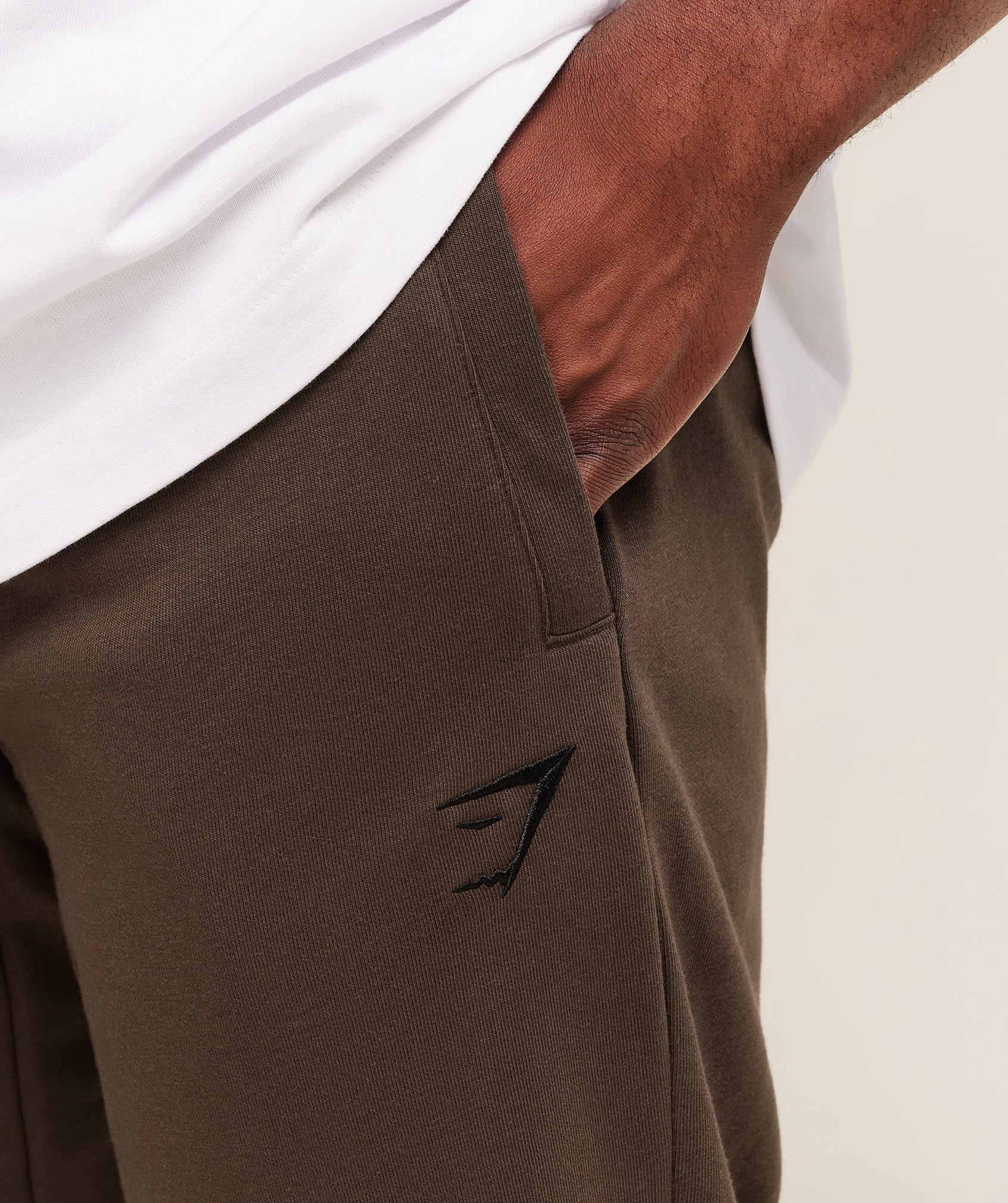gymshark-essential-oversized-joggers-pants-brown-aw25