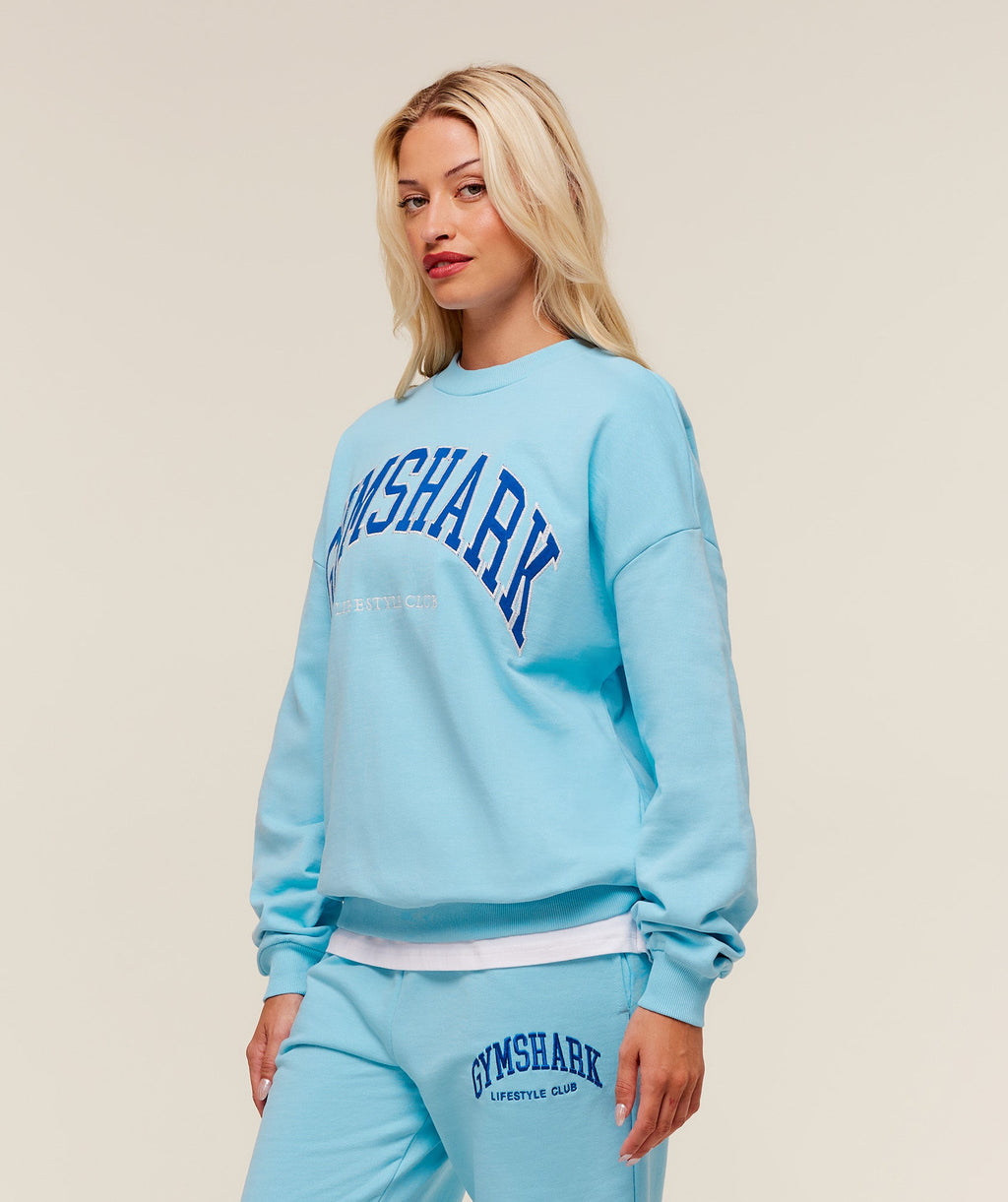 gymshark-collegiate-graphic-crew-neck-pullover-pullovers-blue-aw25