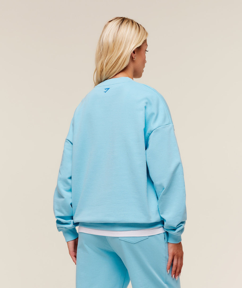 gymshark-collegiate-graphic-crew-neck-pullover-pullovers-blue-aw25
